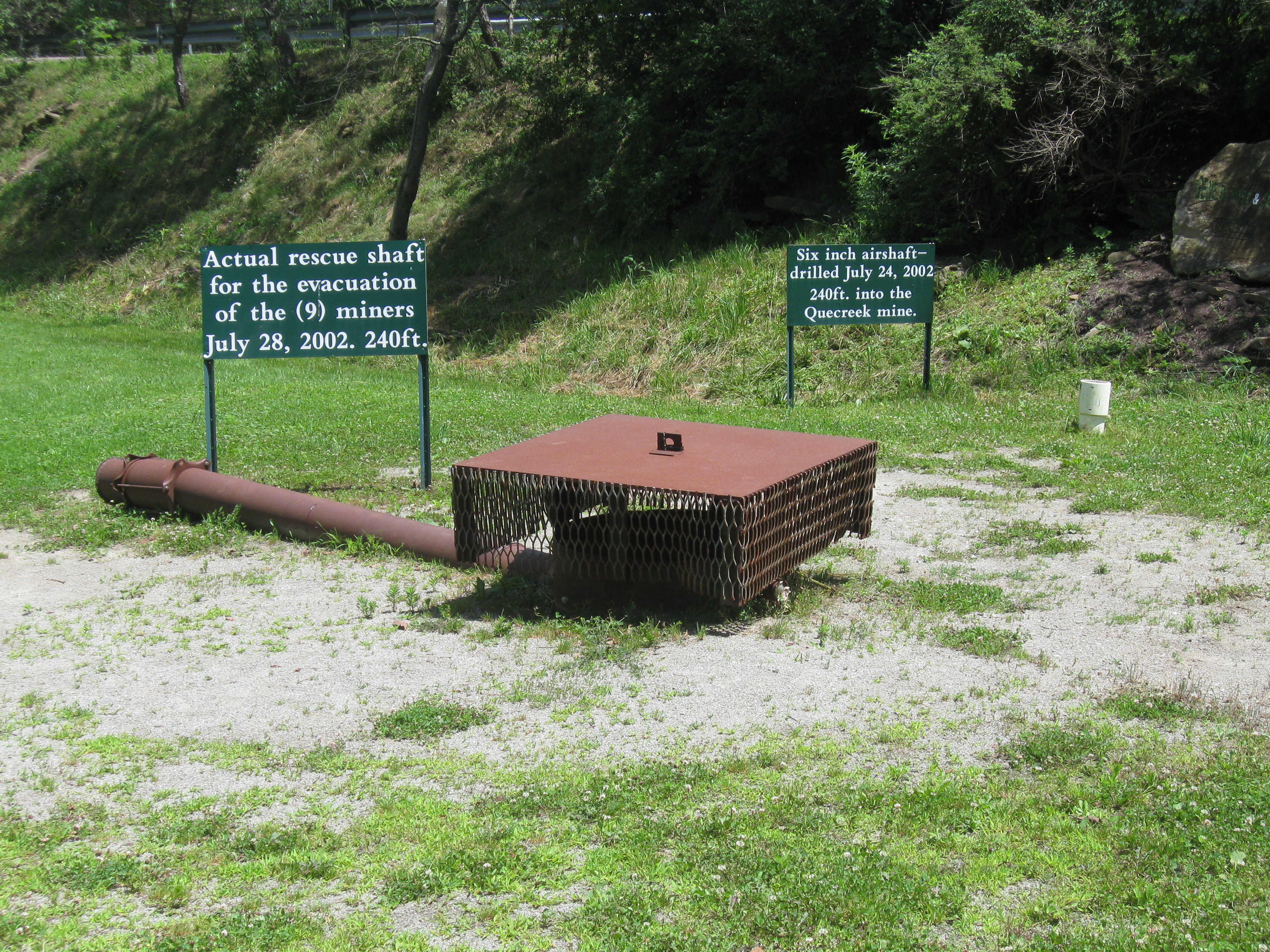 Capped rescue shaft at the Quecreek Mine Rescue site, used to bring all nine trapped miners to the surface successfully in July 2002. The white pipe to the right of the shaft is an air shaft drilled during the immediate response to get air to the miners.