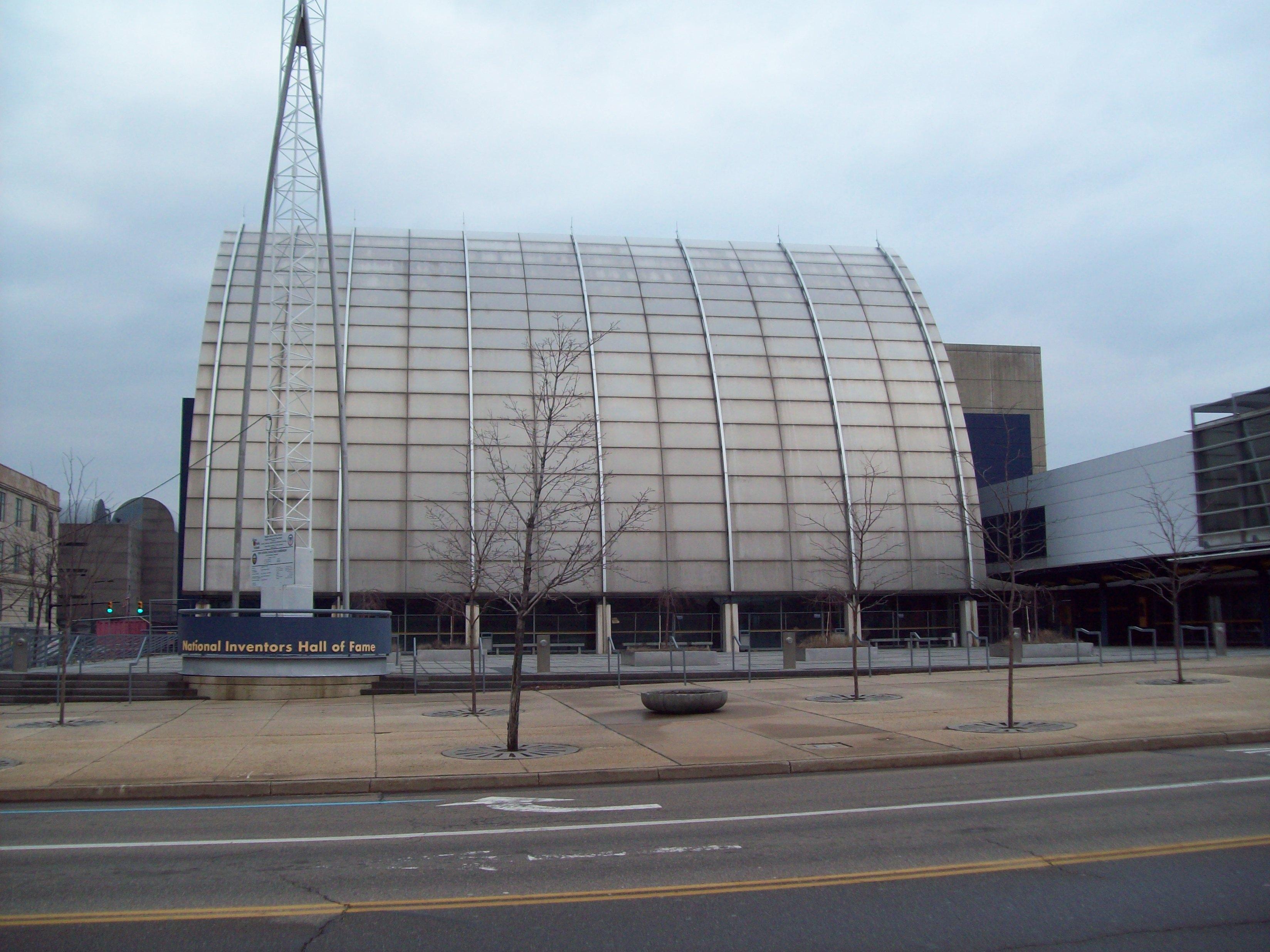 The National Inventors Hall of Fame (1995) in downtown Akron, designed by Polshek and Partners architects (renamed Ennead Architects in mid-2010). Structural steel framed building with curtain wall windows and metal panel finishes, 77,000-square-foot, five-story building, 25,000 square feet of exhibits, free entrance, estimated annual attendance of 300,000 (in 1997).[1];[2]