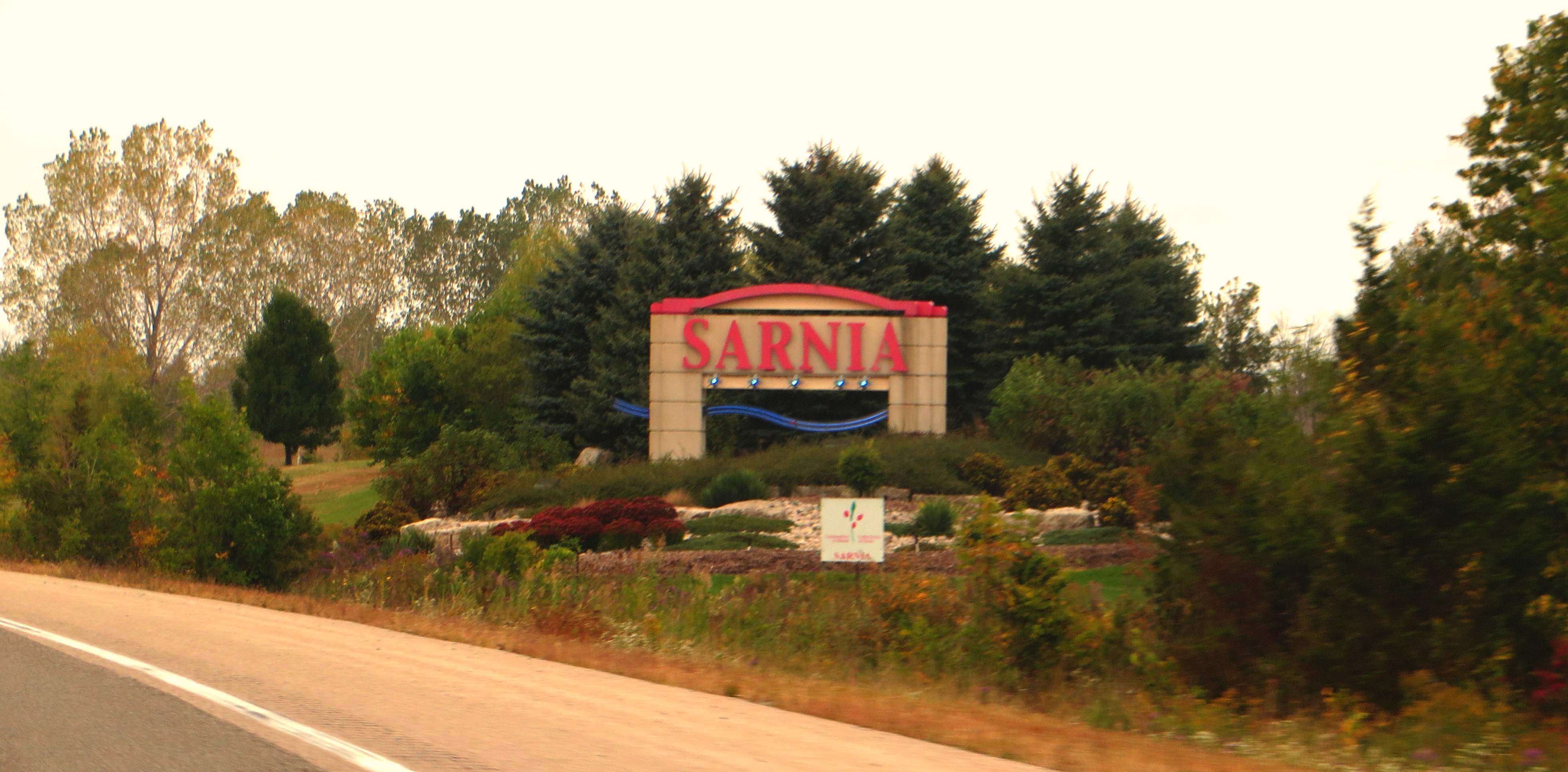 Sarnia is a city in Southwestern Ontario, Canada, and had a 2011 population of 72,366. It is the largest city on Lake Huron and in Lambton County. Sarnia is located on the eastern bank of the junction between the Upper and Lower Great Lakes where Lake Huron flows into the St. Clair River, which forms the Canada-United States border, directly across from Port Huron, Michigan. The city's natural harbour first attracted the French explorer La Salle, who named the site "The Rapids" when he had horses and men pull his 45 tonnes (50 short tons; 44 long tons) barque "Le Griffon" up the almost four-knot current of the St. Clair River on 23 August 1679.
This was the first time anything other than a canoe or other oar-powered vessel had sailed into Lake Huron, and La Salle's voyage was thus germinal in the development of commercial shipping on the Great Lakes. Located in the natural harbour, the Sarnia port remains an important centre for lake freighters and oceangoing ships carrying cargoes of grain and petroleum products. The natural port and the salt caverns that exist in the surrounding areas, together with the oil discovered in nearby Oil Springs in 1858 led to the massive growth of the petroleum industry in this area. Because Oil Springs was the first place in Canada and North America to drill commercially for oil, the knowledge that was acquired there led to oil drillers from Sarnia travelling the world teaching other nations how to drill for oil.
The complex of refining and chemical companies is called Chemical Valley and located south of downtown Sarnia. While in 2011, the city had the highest level of particulates air pollution of any Canadian city, it has since dropped down to 30th. About 60 percent of the particulate matter, however, comes from the neighboring United States. Lake Huron is cooler than the air in summer and warmer than the air in winter; therefore, it moderates Sarnia's humid continental climate, which makes temperature extremes of hot and cold very rare. In the winter, Sarnia experiences lake-effect snow because Arctic air blows across the warmer waters of Lake Huron and condenses to form snow squalls once over land.
Culturally, Sarnia is a large part of the artistic presence in Southern Ontario.
en.wikipedia.org/wiki/Sarnia
en.wikipedia.org/wiki/Wikipedia:Text_of_Creative_Commons_...