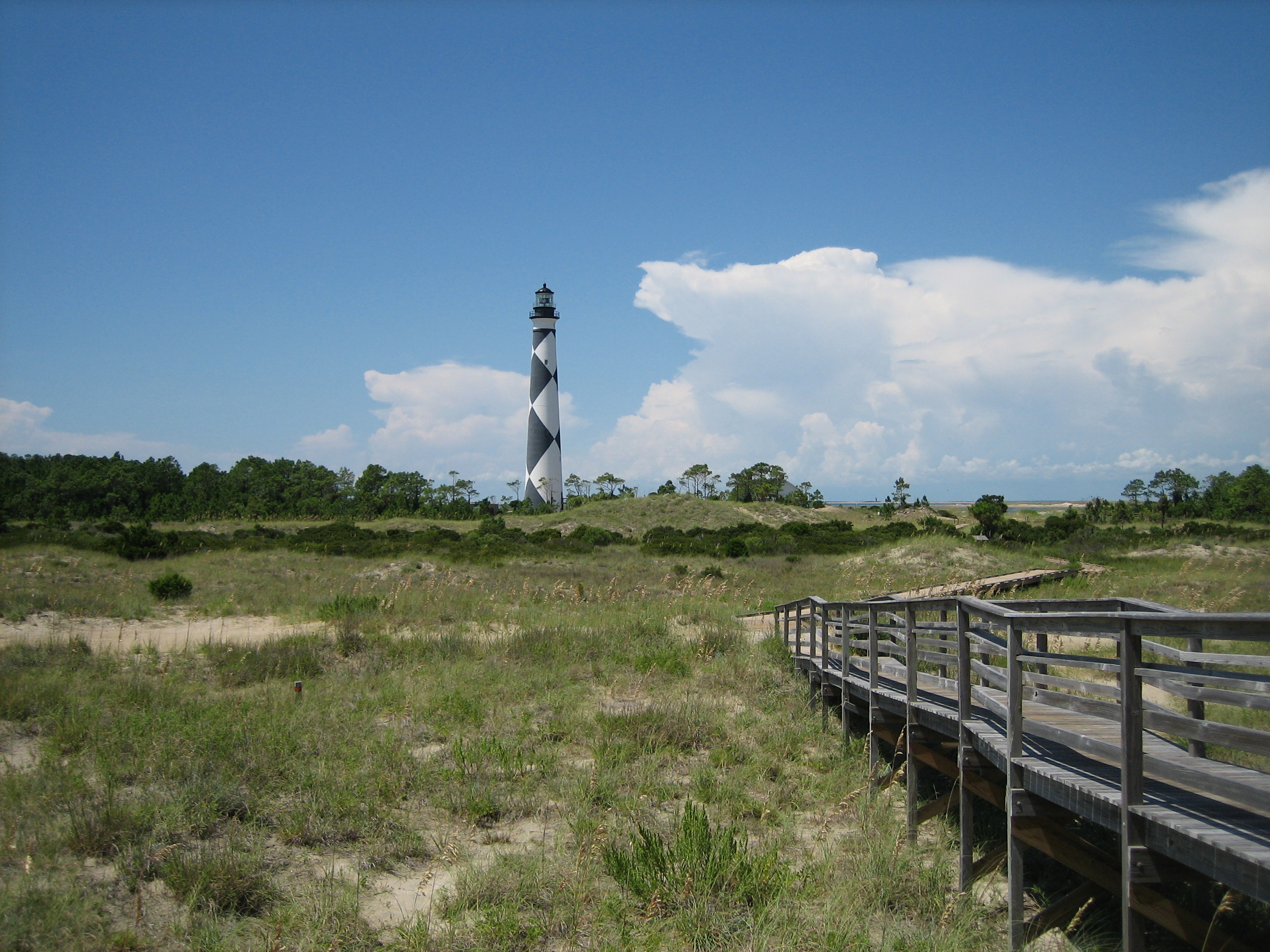 View of Cape Lookout Lighthouse from a public beach access on South Core Banks, Carteret County, North Carolina, United States. South Core Banks are one of three islands included in the Cape Lookout National Seashore.