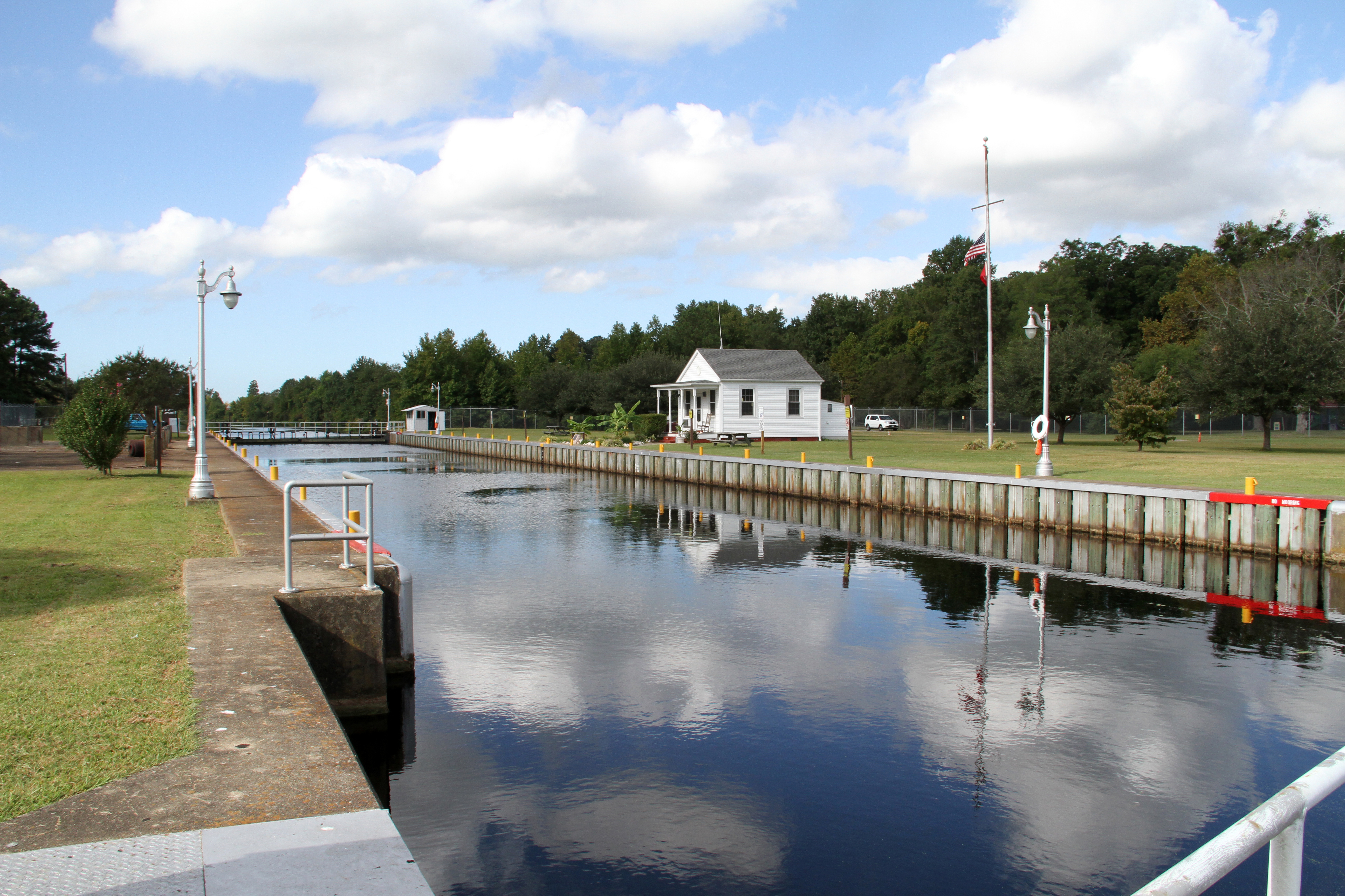 CHESAPEAKE, Va. -- Lockmaster Robert Peek maintains Deep Creek's 25-acre site named for the Corps of Engineers' lock which separates the salt water of Deep Creek from the fresh water of the historic Dismal Swamp Canal. It is heavily wooded with a combination pedestrian bridge/elevated walkway system to traverse a tidal inlet and marsh area. More than 600 vessels go through the lock each year. (U.S. Army photo/Pamela K Spaugy)