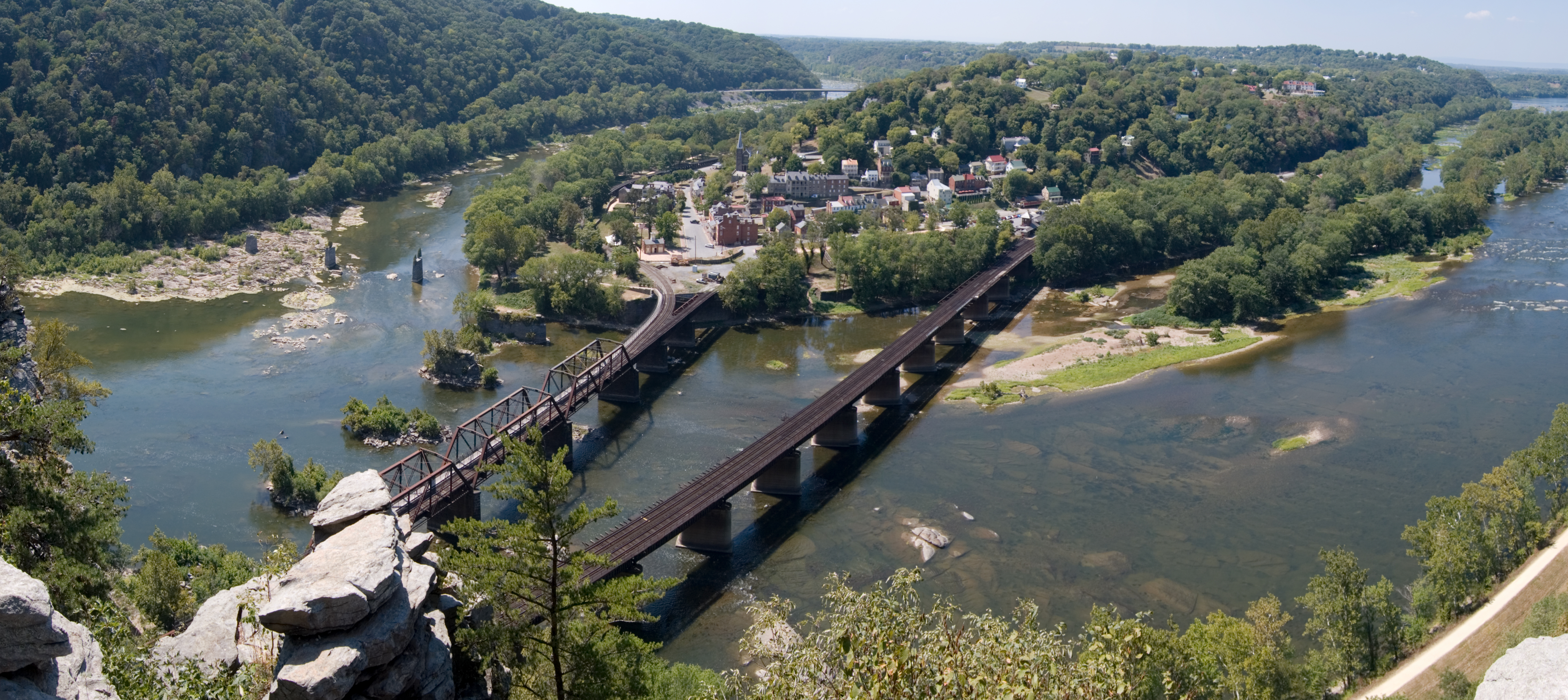 Panoramic view of Harpers Ferry from Maryland Heights, with the Shenandoah (left) and Potomac (right) rivers. (This is a cropped version, excluding the non-rectangular border which resulted from stitching.)