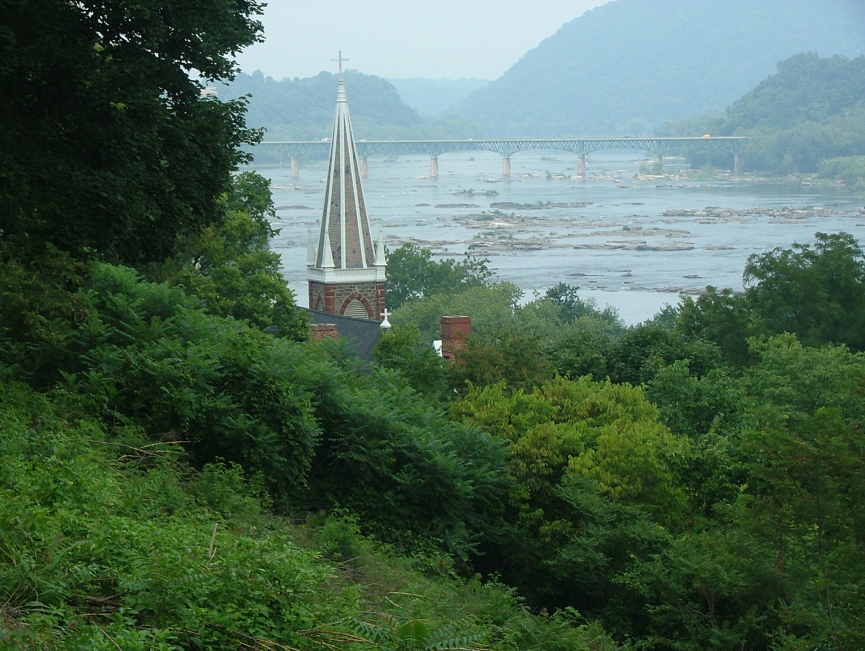 Looking eastward from Jefferson Rock, with Harpers Ferry, West Virginia in the foreground.  In the distance is the Potomac River bridge, connecting Maryland (left bank) with Virginia along U.S. Highway 340.

Jan Kronsell, 2004