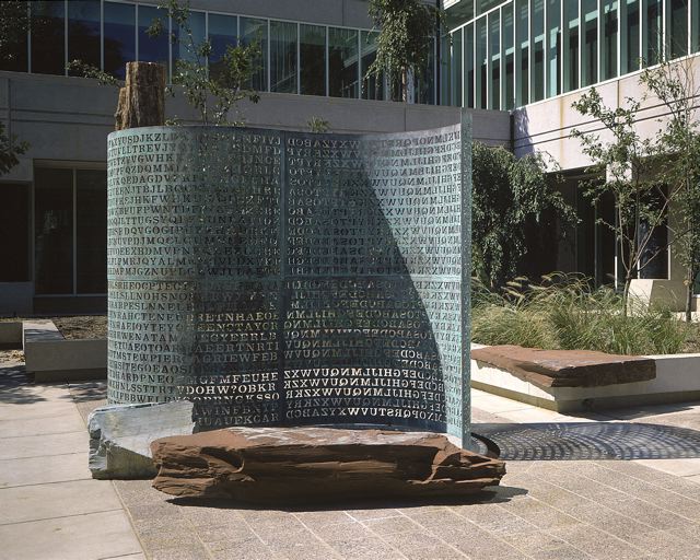"Kryptos" by James Sanborn, is one of the three sculptures at the George Bush Center for Intelligence grounds. It runs a theme of information gathering and includes an encoded copper screen. Low-res image of the CIA's Kryptos sculpture, provided by the sculptor, w:Jim Sanborn.