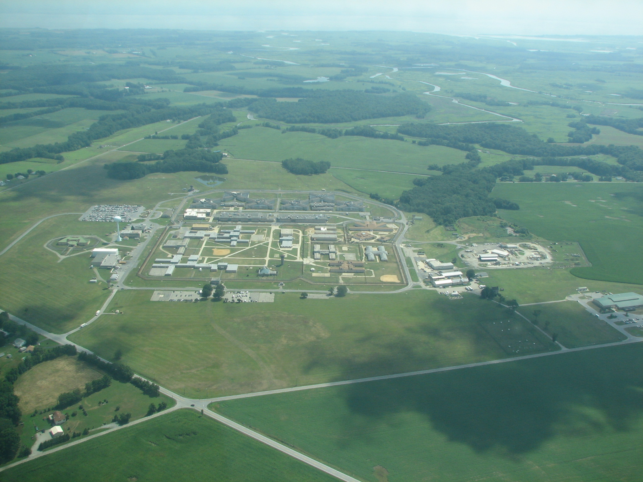 This is now the James T Vaughn Correctional Center (and was Delaware Correctional Center).  These things always stand out when flying by.  The Delaware River (bay?) is in the background.