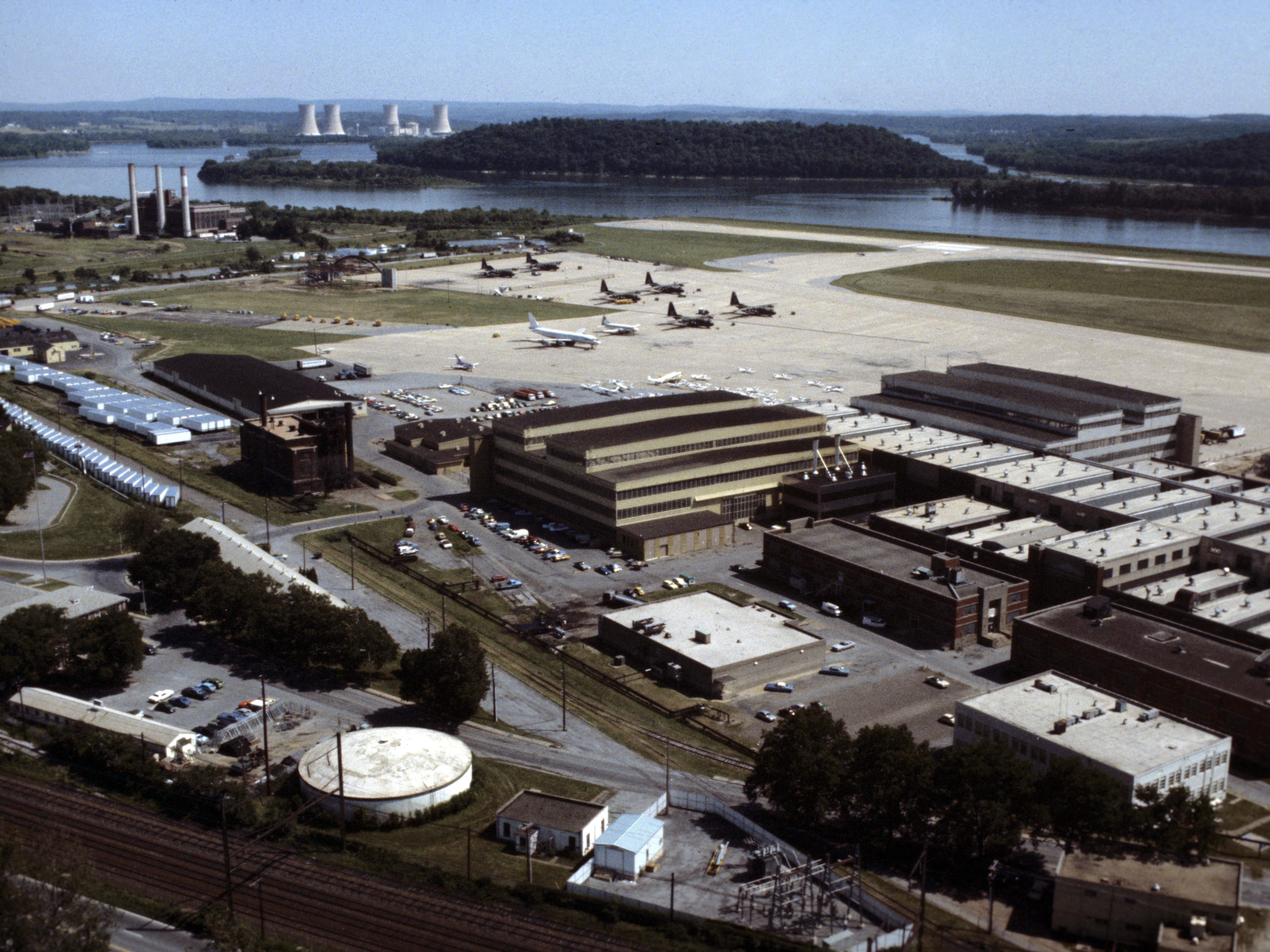 An aerial slide photo of the U.S. Air Force 193rd Tactical Electronic Warfare Group station, Pennsylvania Air National Guard, at the Harrisburg International Airport, Pennsylvania (USA), in May 1979. 

The Three Mile Island Nuclear Generating Station after the March 1979 nuclear accident.
The future home of the 193rd is visable on the left side by the Susquehanna River near the top of the photo.