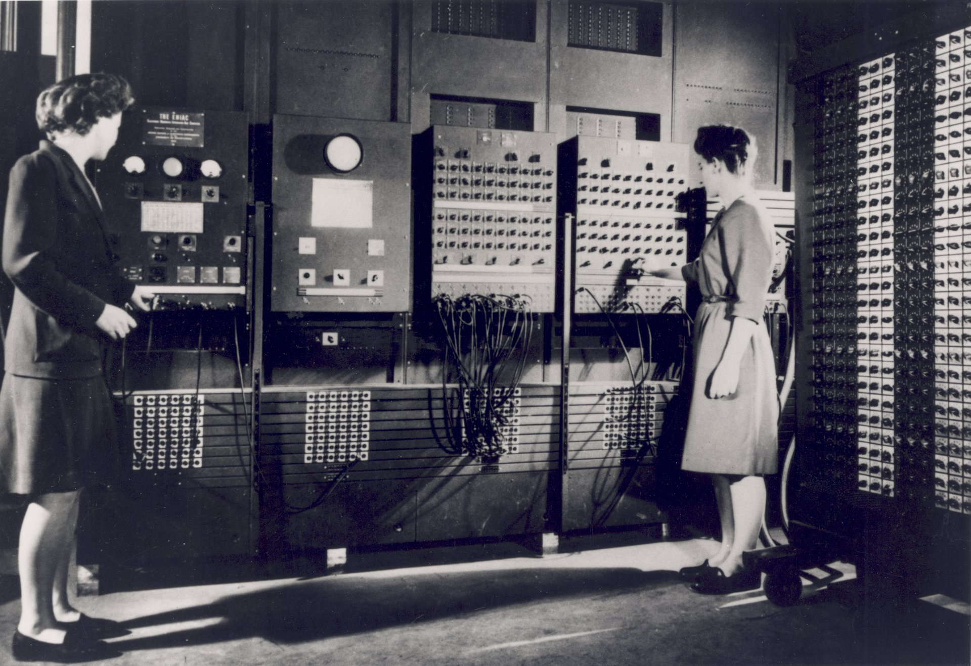 Two of the ENIAC programmers, are preparing the computer for Demonstration Day in February 1946. "U.S. Army Photo" from the archives of the ARL Technical Library. Left: Betty Jennings (Mrs. Bartik), right: Frances Bilas (Mrs. Spence).