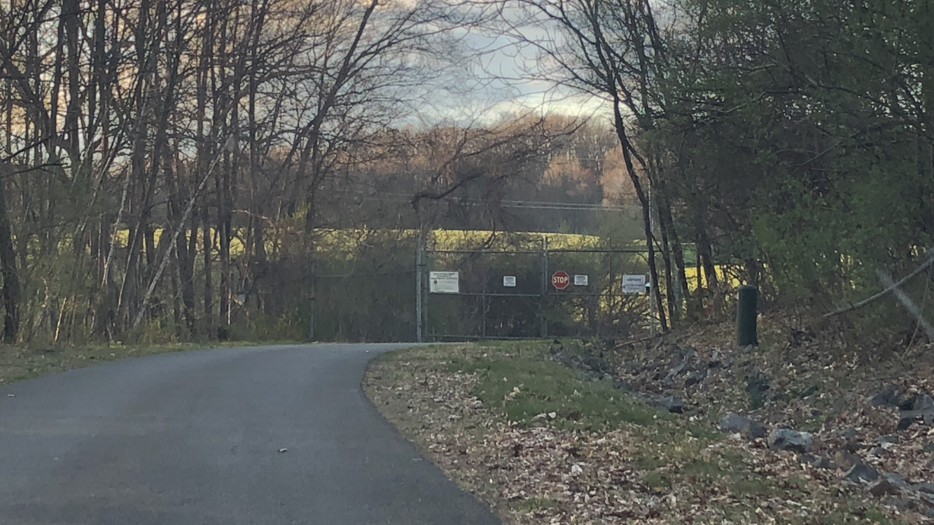 The entrance gate to the Combe Superfund Site
