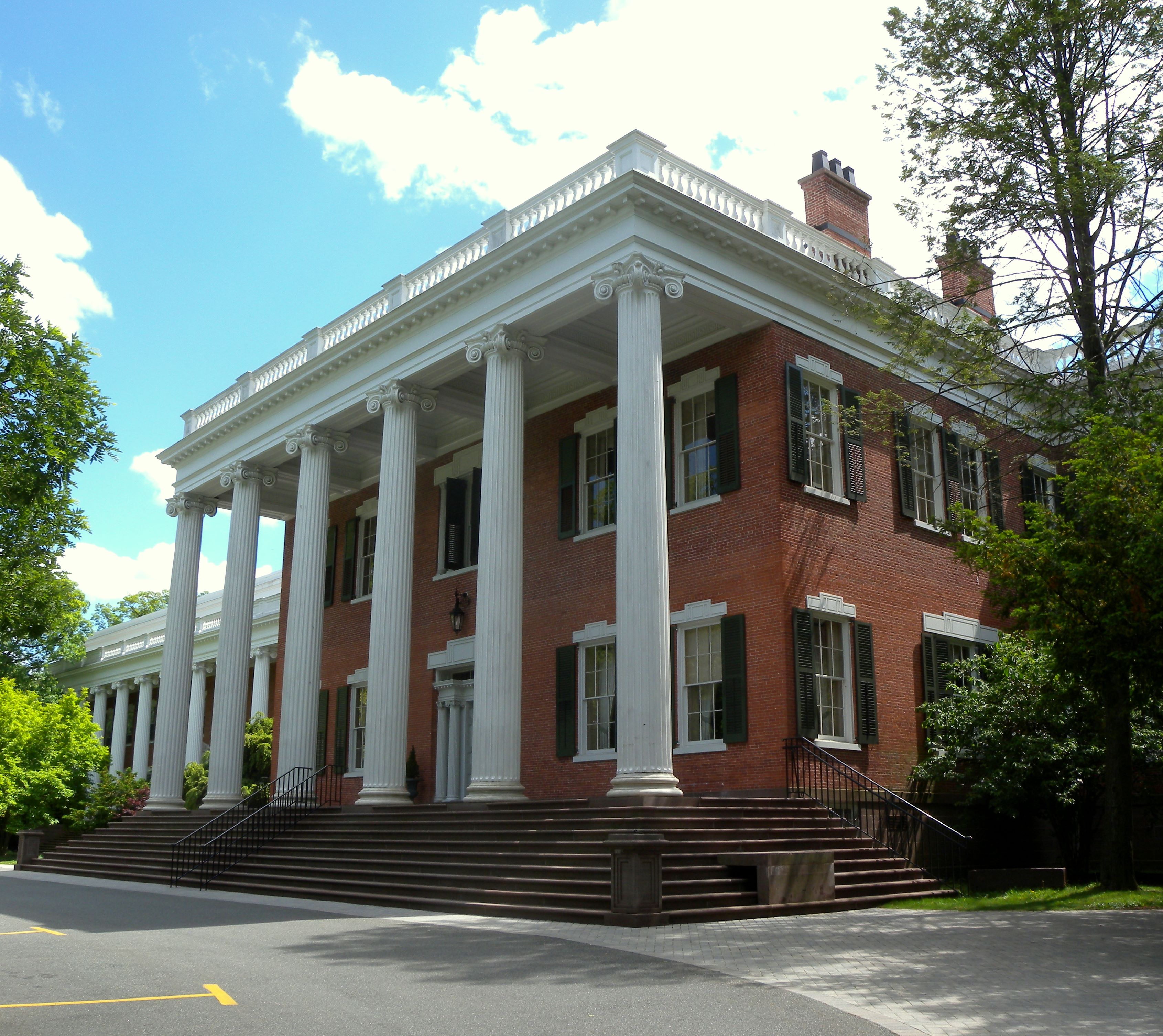 Looking south at Mead Hall, an 1836 Greek Revival house on the Drew University campus, New Jersey, on a mostly sunny early afternoon.  See also File:Mead Hall sign Drew U jeh.jpg.