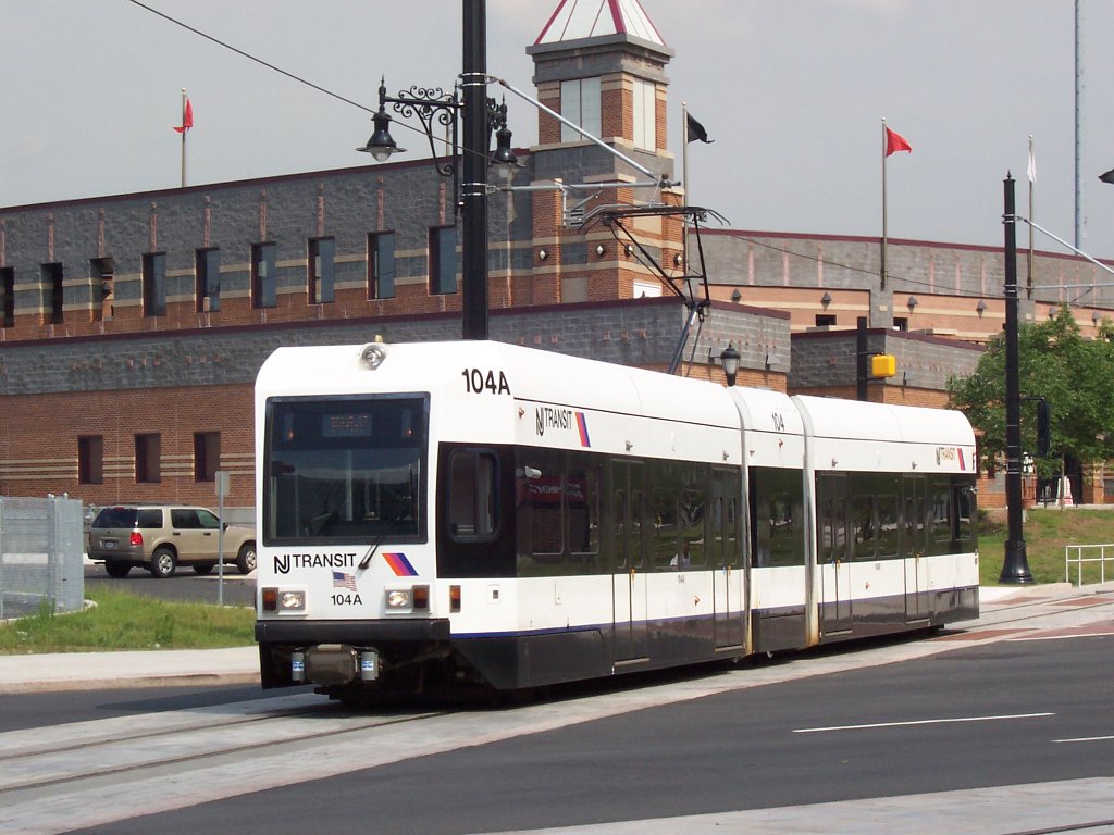 NJ Transit Newark Light Rail #104 crossing Broad Street in Newark, New Jersey, to enter the Newark-Broad St. Station.