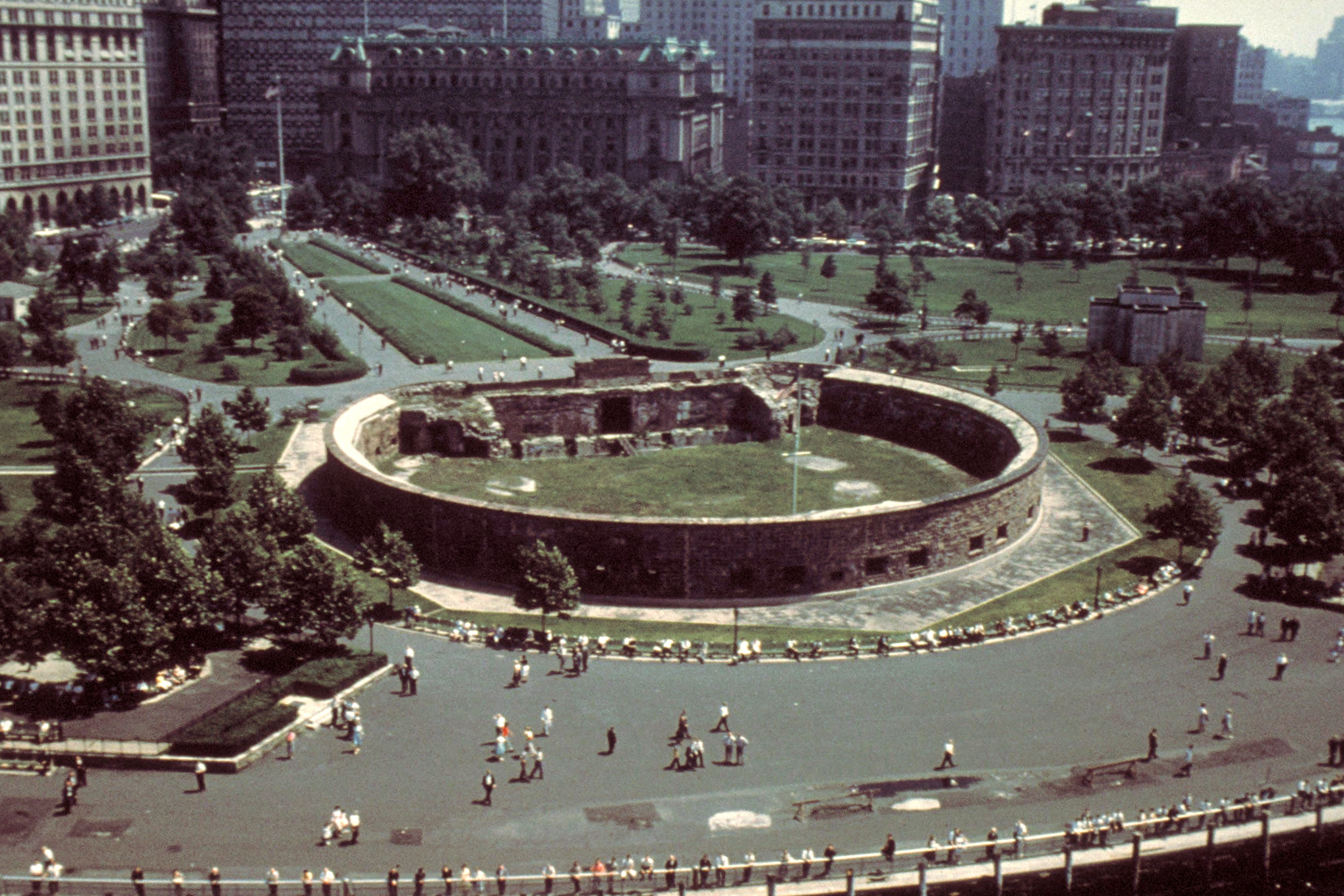 Aerial view of Castle Clinton National Monument, New York

        (regarding date of image: can't be from 2004; 2 Broadway finished 1959; Broad Street Hospital demolished 1967 (not quite sure, if it is there, but looks like that))