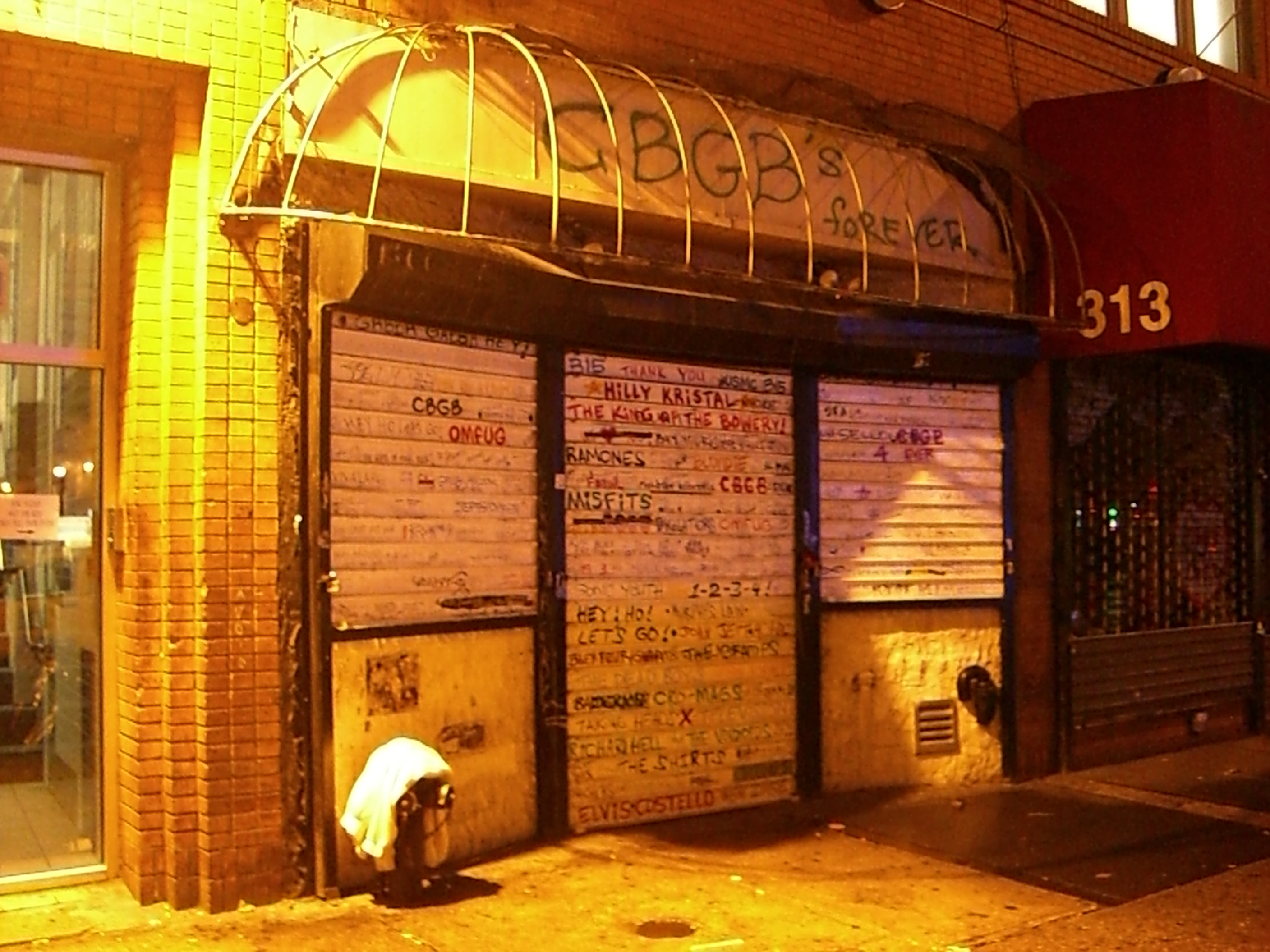 This is a photo of en:CBGB after they closed and the awning was taken down.