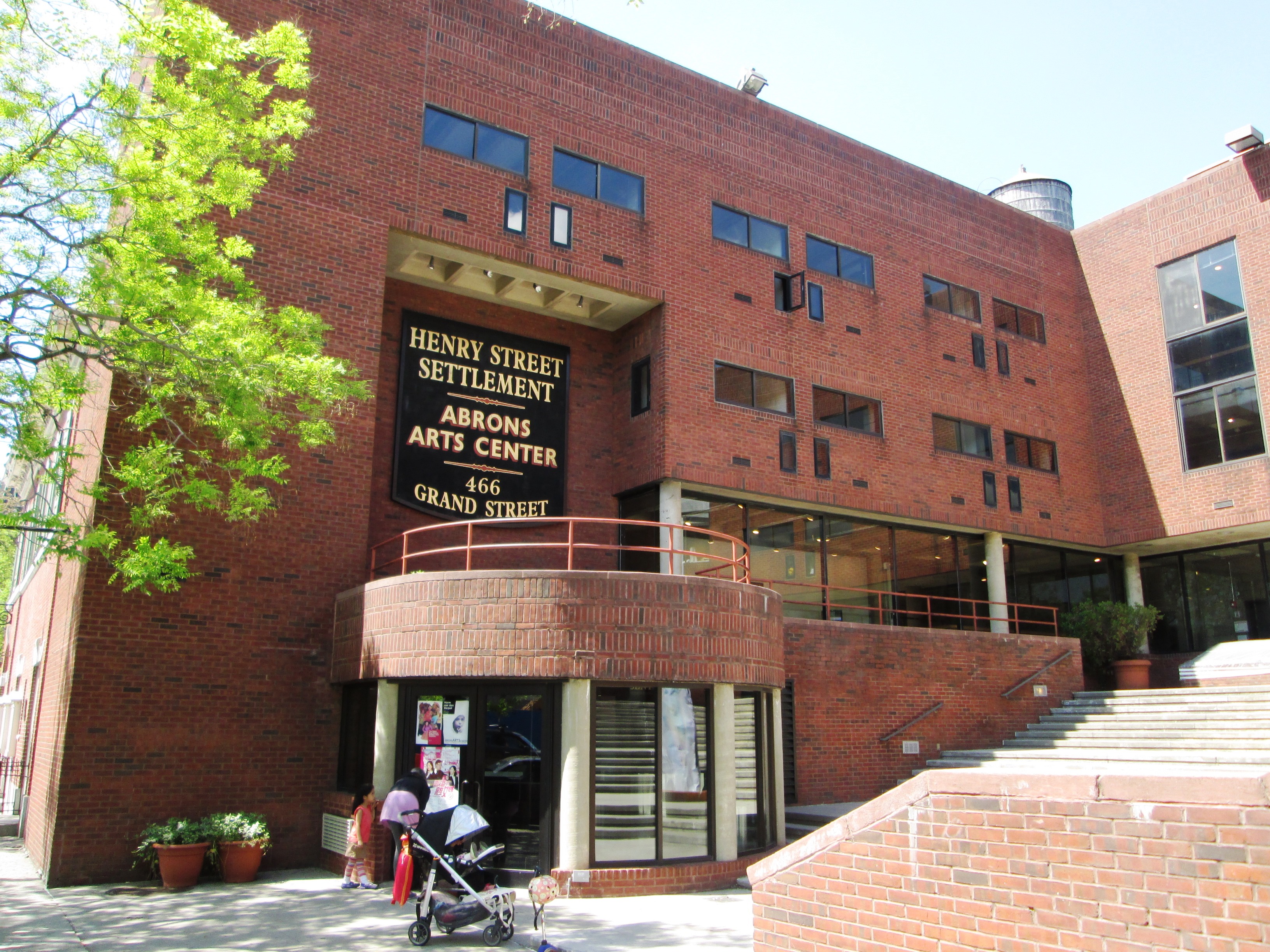 The Louis Abrons Arts for Living Center' at 466 Grand Street between Pitt Street and Bialystoker Place in the Lower East Side neighborhood of Manhattan, New York City was built in 1975 and was designed by Prentice &amp; Chan Ohlhausen.  It is part of the Henry Street Settlement. (Source: AIA Guide to NYC (5th ed.))