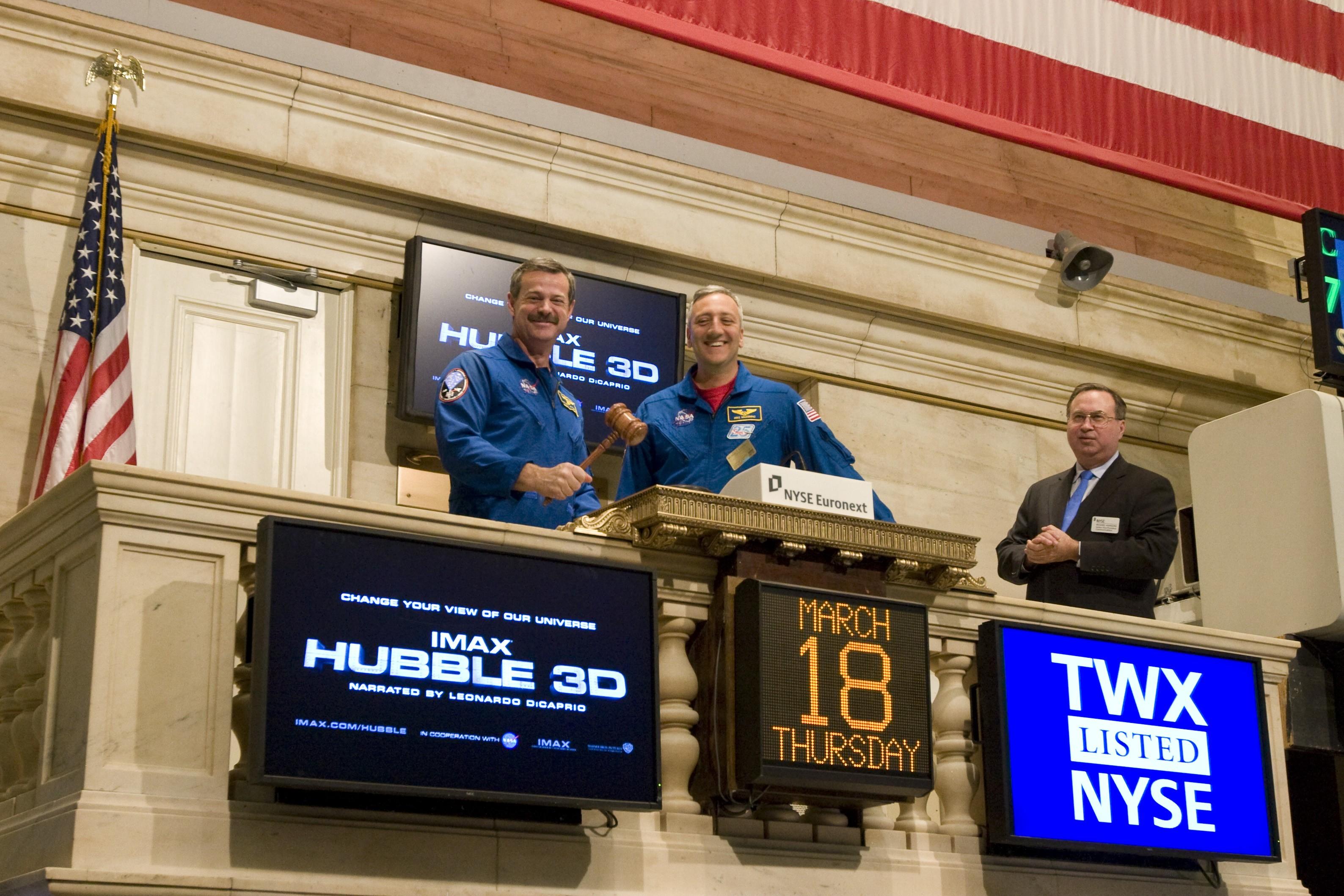 NASA astronauts Scott Altman and Mike Massimino of the STS-125 mission visit the New York Stock Exchange to support the release of Hubble 3D, the newest IMAX film, which documents the mission to repair the Hubble Space Telescope and features never-before-seen 3D flights through Hubble imagery such as the Orion Nebula. In honour of the occasion, Altman and Massimino ring 'The Closing Bell' ending the day's trading at the Exchange on Thursday, March 18, 2010.