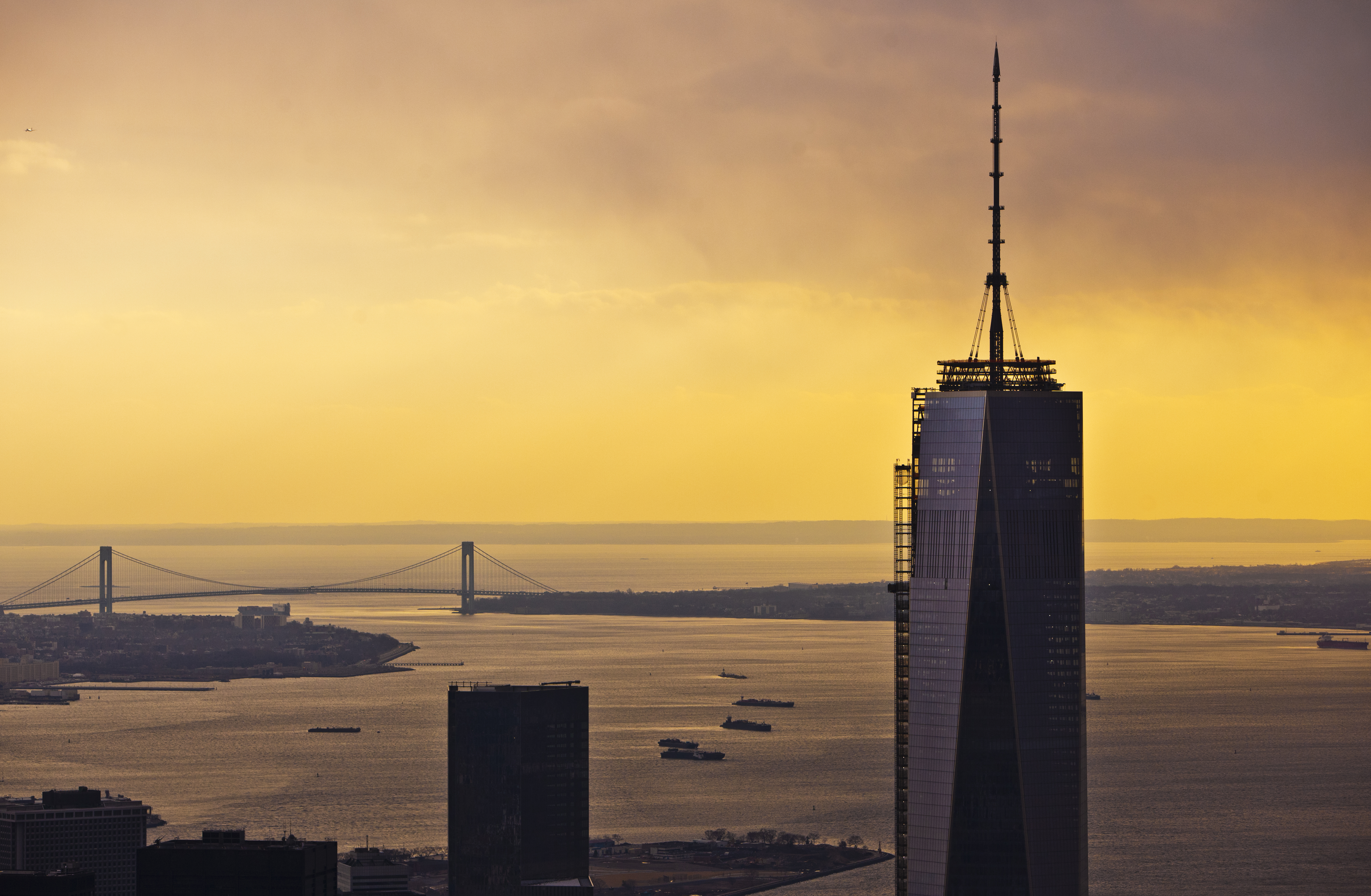 Sunset view of the One World Trade Center, Upper New York Bay, Verrazano-Narrows Bridge, and Staten Island looking south