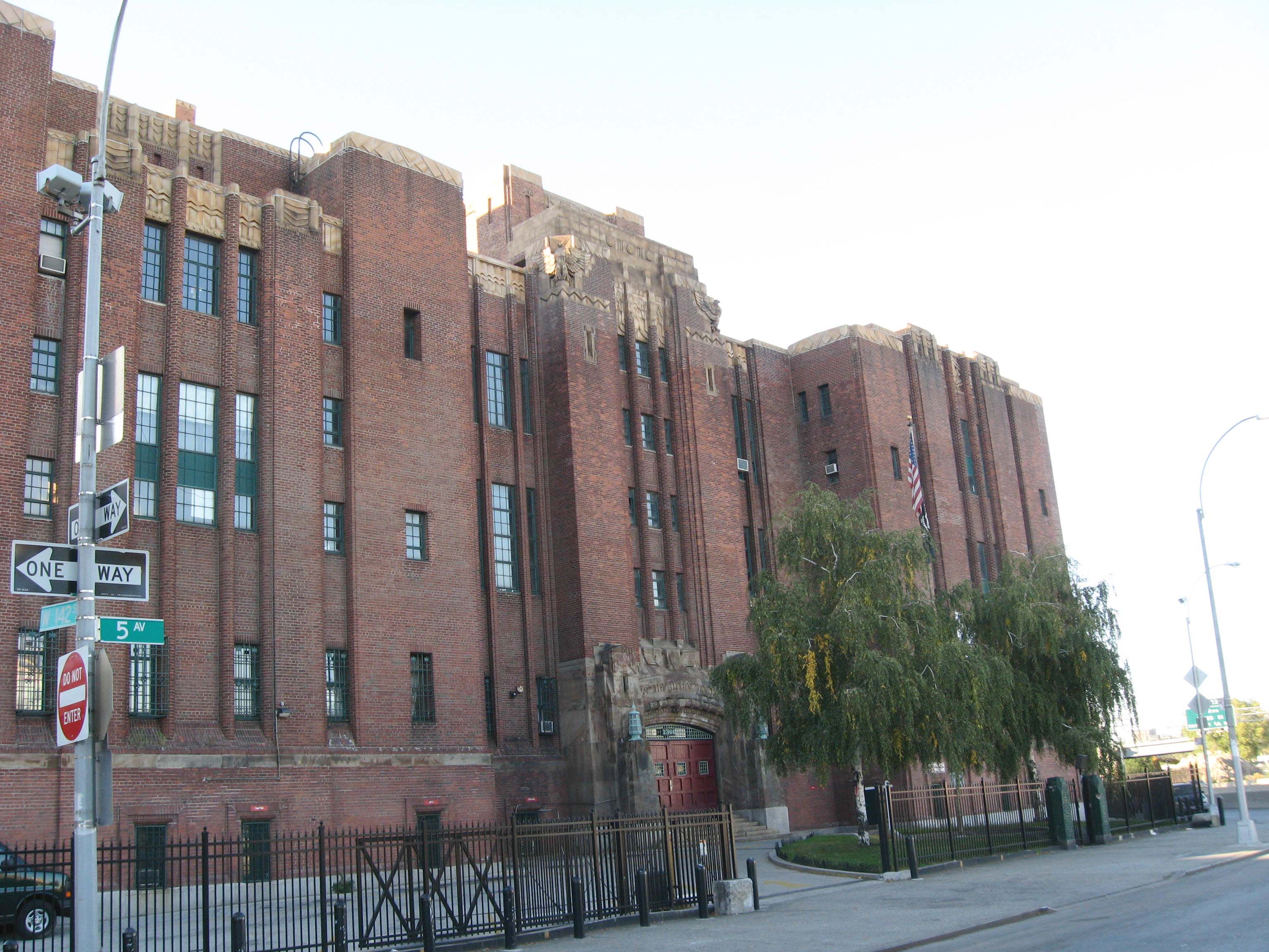 Looking north across 5th Avenue at armory of en:369th Infantry Regiment (United States) on a sunny afternoon