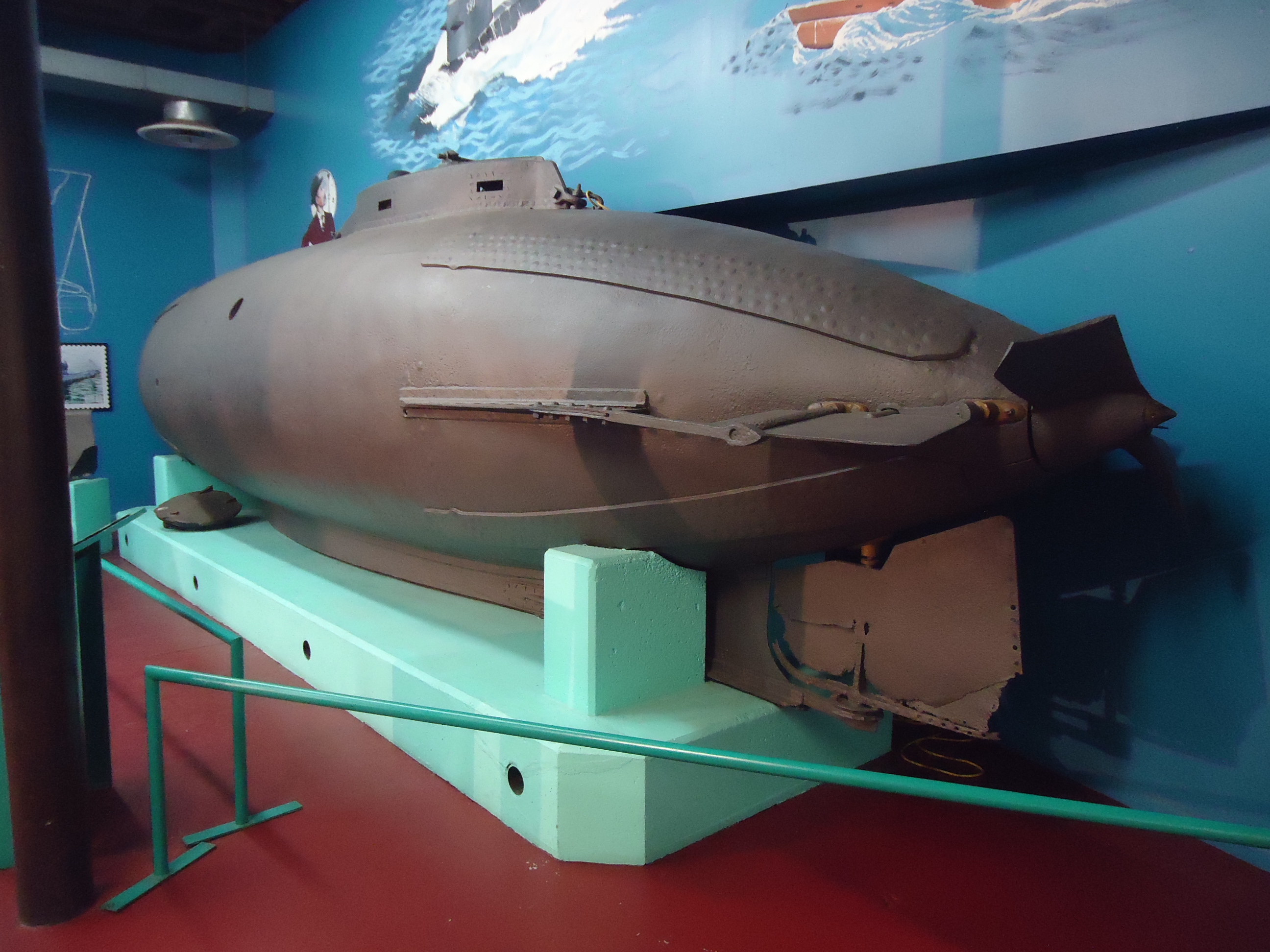 Images from the Paterson Museum in Paterson, New Jersey. Paterson was the location of early manufacturing, much of it powered by the Great Falls nearby in which the Passaic River drops 77 feet. Early manufacturing included clothing, guns, railroad locomotives, submarines and aircraft engines. In this image: early submarine about 10 feet long and a few feet high.