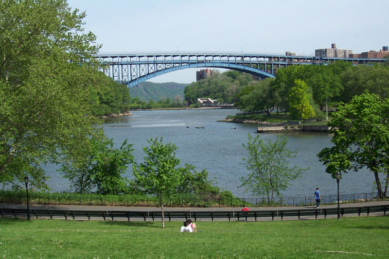 Looking northwest along a former part of the Harlem River in Inwood Hill Park in May 2002. The Henry Hudson Bridge and New Jersey Palisades can be seen in the background. The peninsula on the right was originally in The Bronx.