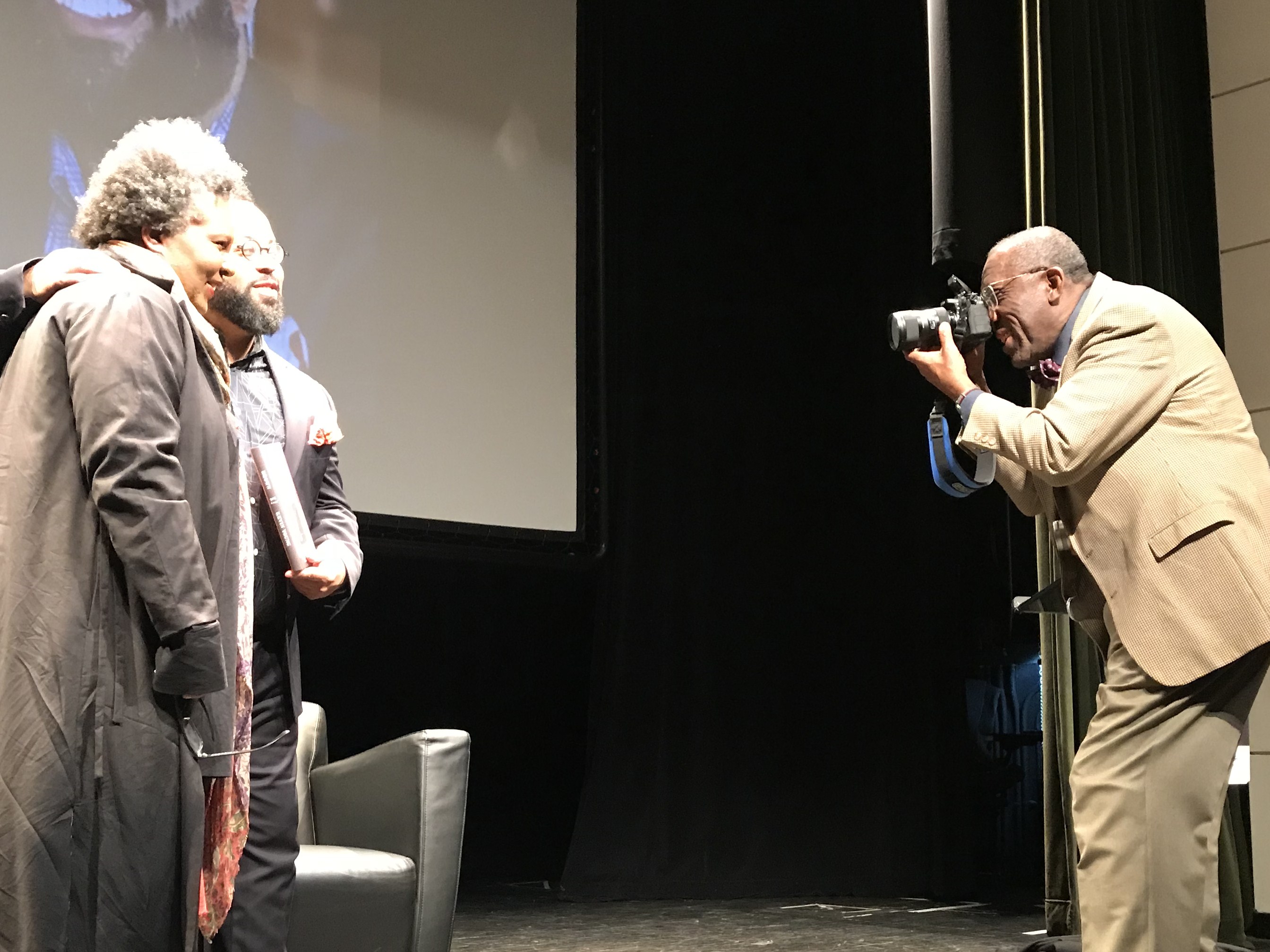 Schomburg Center staff photographer Bob Gore, photographs Kevin Young, Director of Schomburg Center and poet Claudia Rankin at a Schomburg Center Event