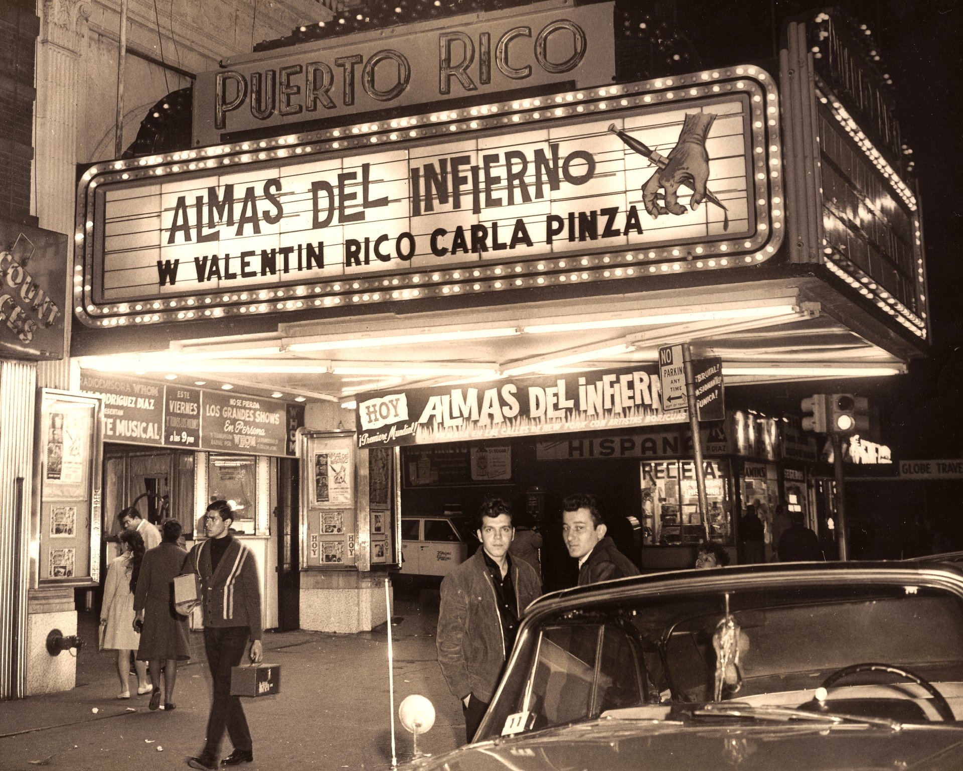 The "Teatro Puerto Rico" marquee, promoting the movie "Almas del Infierno," starring William Valentin Rico and Carla Pinza, in April of 1966. The movie premiered in 12 theaters throughout the Bronx, Manhattan, and Brooklyn. It was then released in Connecticut, Illinois, New Jersey, and Pennsylvania. The movie was directed and produced by Anthony Felton.