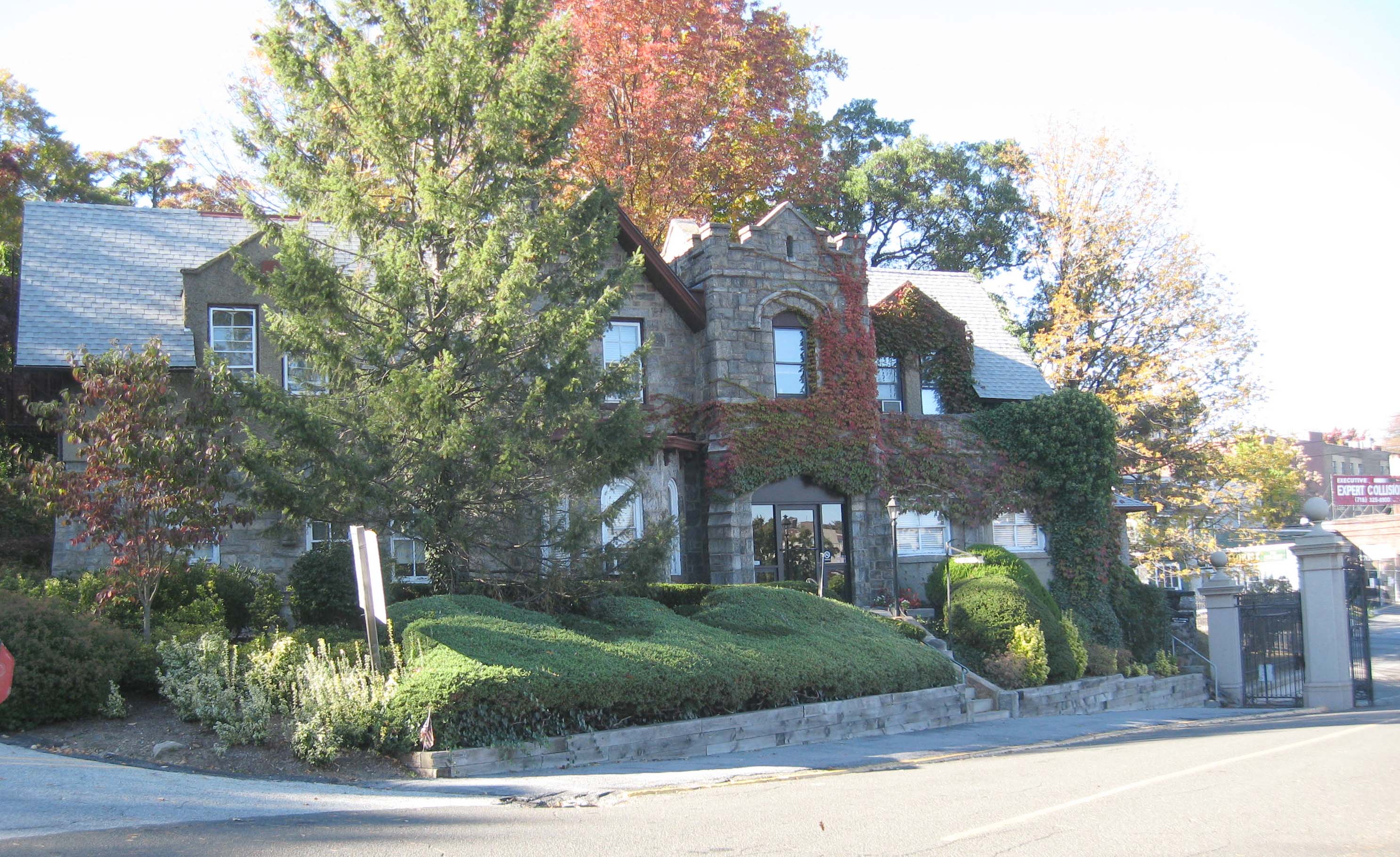 Looking northwest at northeastern gate house of w:Woodlawn Cemetery, Bronx on a sunny early afternoon