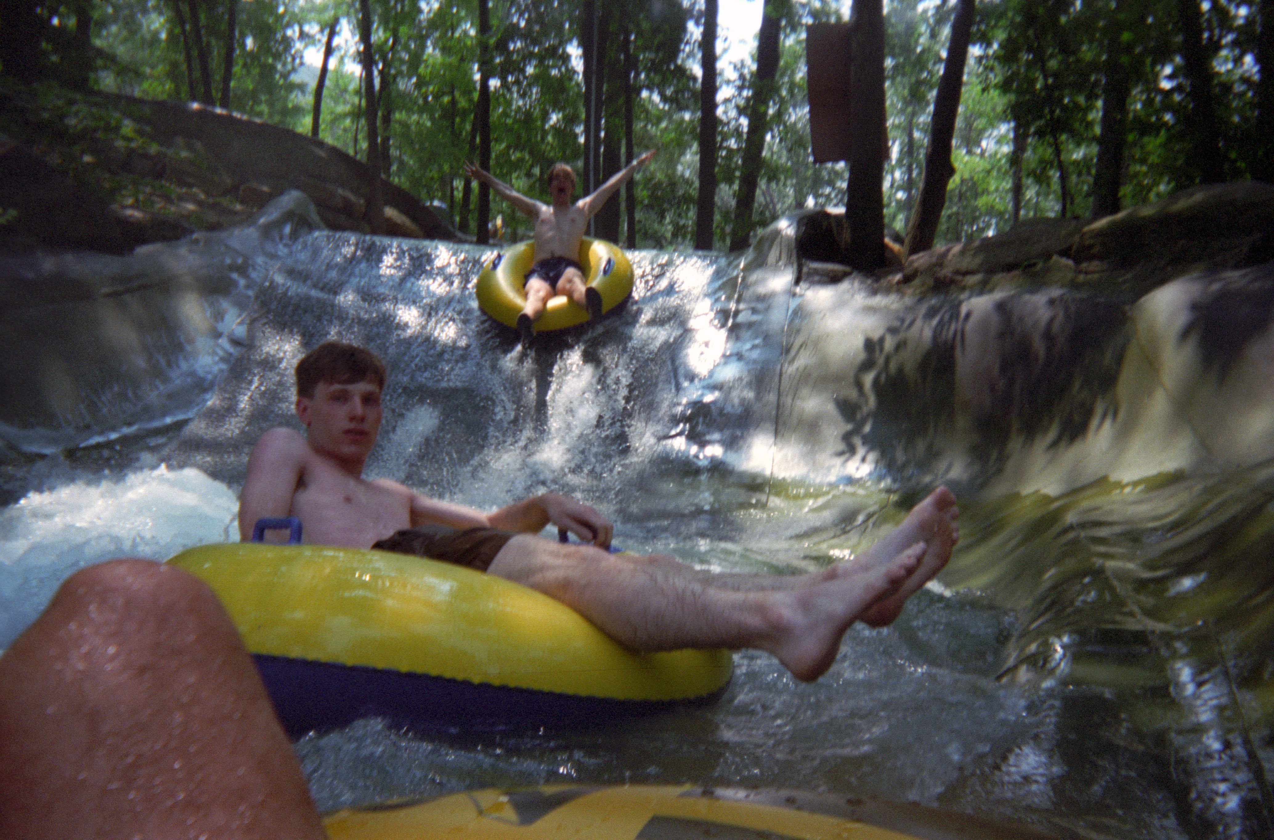 I really loved the waterslides that were very scenically built into the side of the mountain. This one was a series of mini-slides that emptied into mini-pools that you'd float around in until another tube knocked you out to the next slide. Very fun.

Action Park, Vernon, New Jersey, August 1994