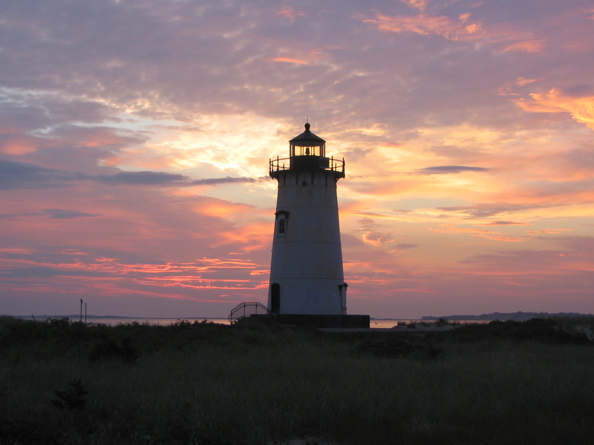 Photo of Edgartown light at dawn, taken in July 2006. This is one of 5 lighthouses on Martha's Vineyard and is located near North Water Street on Edgartown, MA harbor.