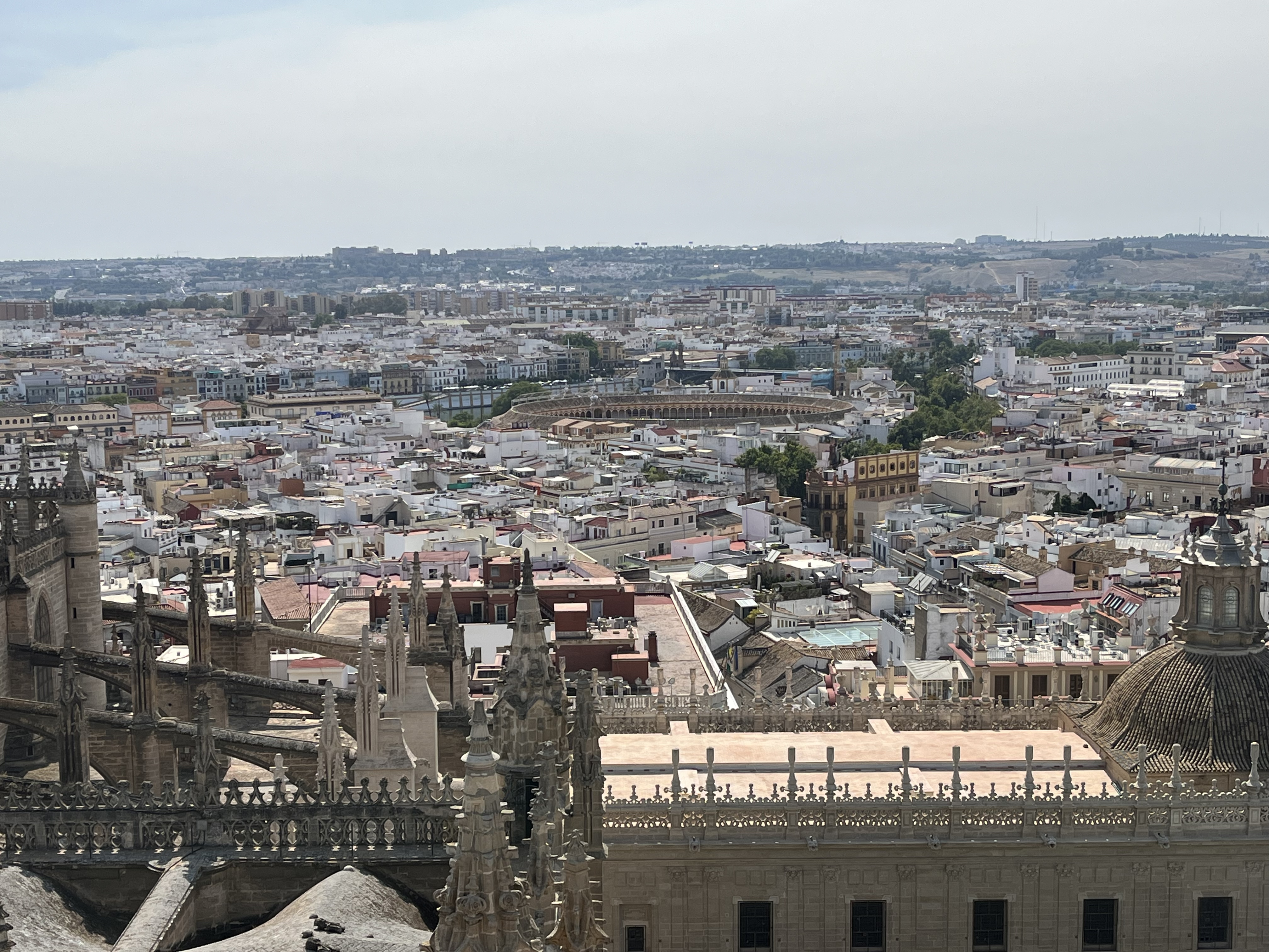 A view facing West from the top of the Giralda Tower toward the Plaza de Toros in Seville and the Guadalquivir River