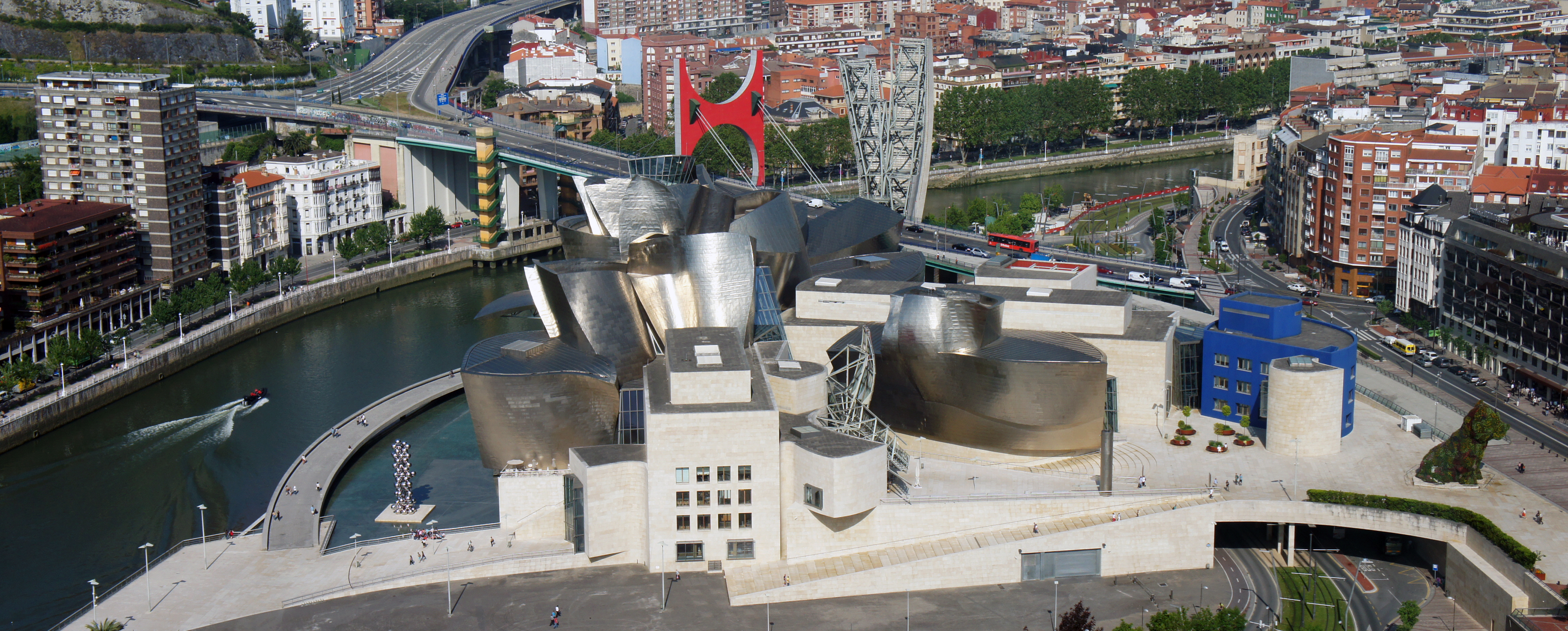 Panoramic view of the Guggenheim Museum Bilbao from the Iberdrola Tower. The La Salve bridge is in the background. The Museum is located on the left bank of the Nervion river. Bilbao, Basque Country, Spain.