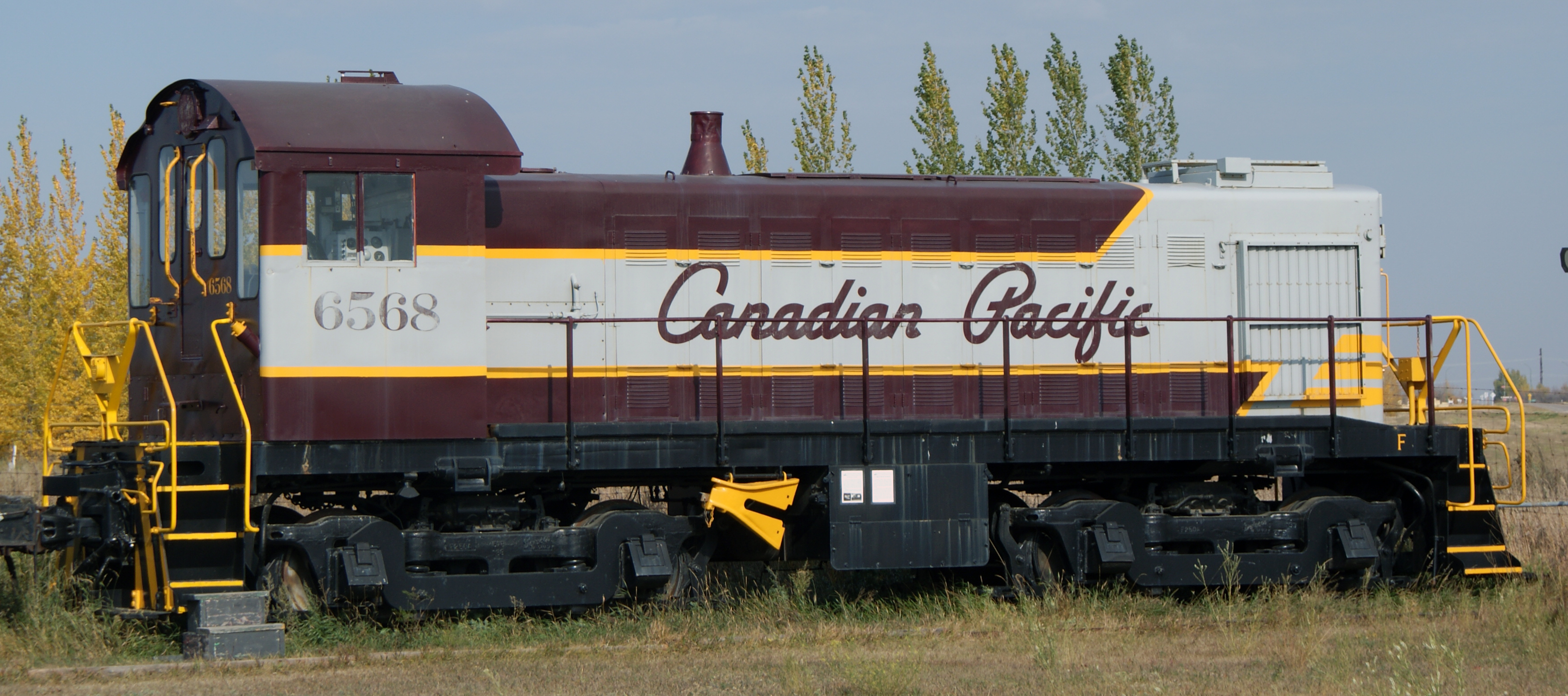 Saskatchewan Railway Museum Canadian Pacific Railway S3  diesel electric locomotive #6568  constructed in 1957 by Montreal Locomotive Works.  According to the SRM, it has a 660 horsepower McIntosh and Seymore 539 diesel engine which operates a General Electric generator.  The electricity produced is 600 volts direct current which turns four traction motors driving each axle.  This locomotive was used in Sutherland CPR train yards.  This particular railway locomotive is a light switcher and was used to switch cars between tracks in the Sutherland train yards.
