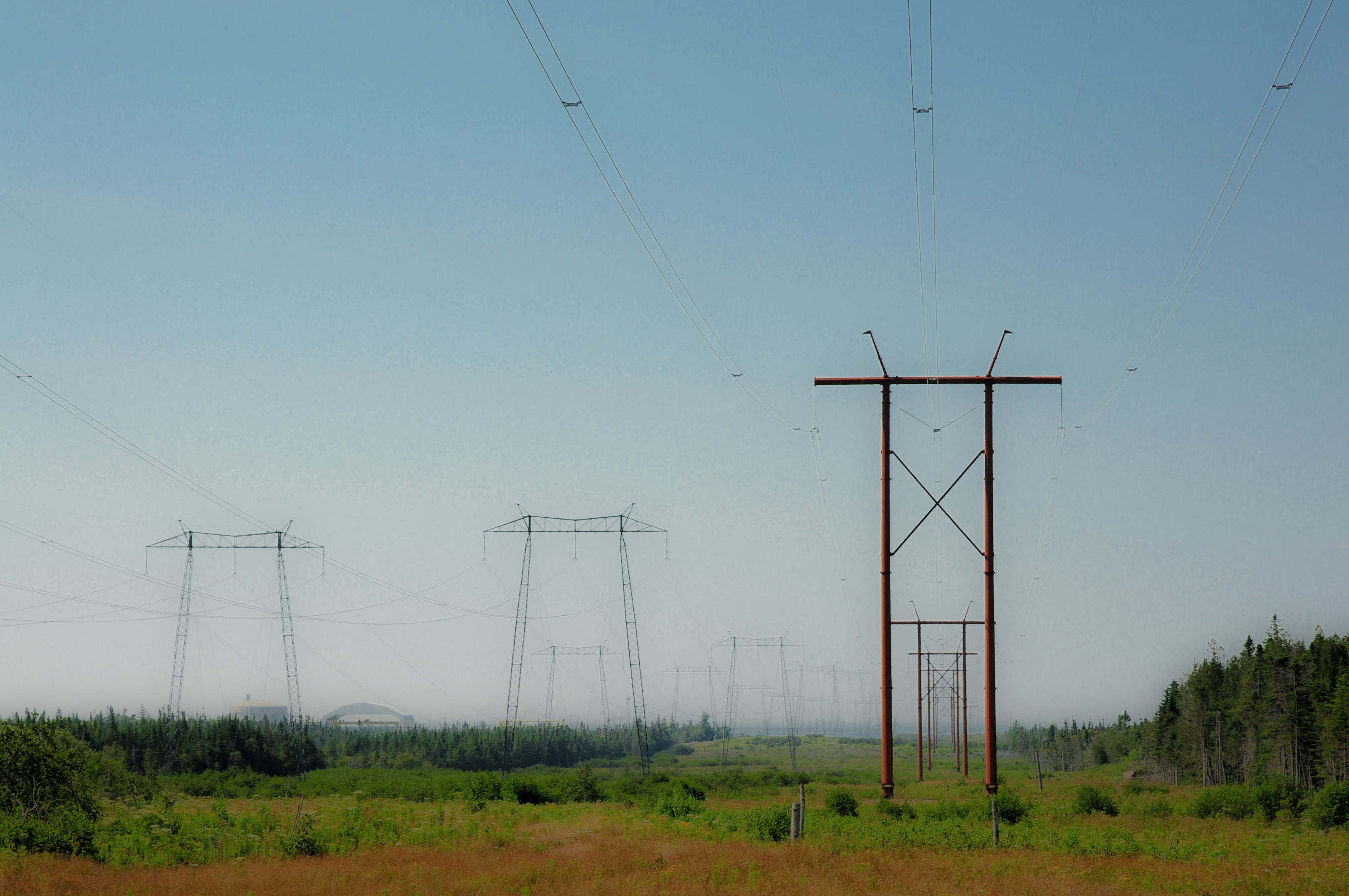 Power lines near the Point Lepreau (New Brunswick, Canada) nuclear generating station (in the background on the top left)