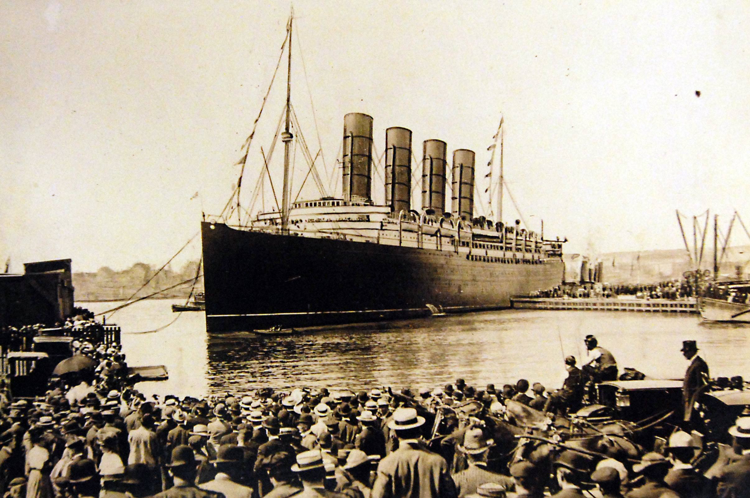 Lot-10973-1:   RMS Lusitania warping into doc after record breaking run from Queenstown, Ireland, to New York City, New York, September 13, 1907. Thousands crowded the river shores and all the fleet in the New York Harbor tooted shrill welcome when Lusitania arrived after lowering the record from Queenstown to 5 days and 54 minutes.   The Lusitania’s sister ship was the Mauretania.   George C. Bain Collection.  Courtesy of the Library of Congress, also as LC-USZ62-55380.  (2016/10/14).