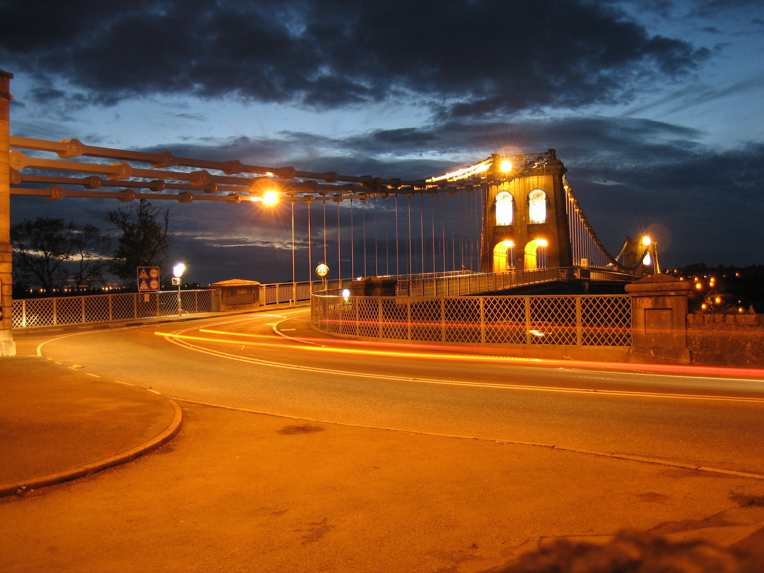This is a 2.5 second exposure of en:Menai Suspension Bridge in en:Wales using a Canon Digital IXUS 55.