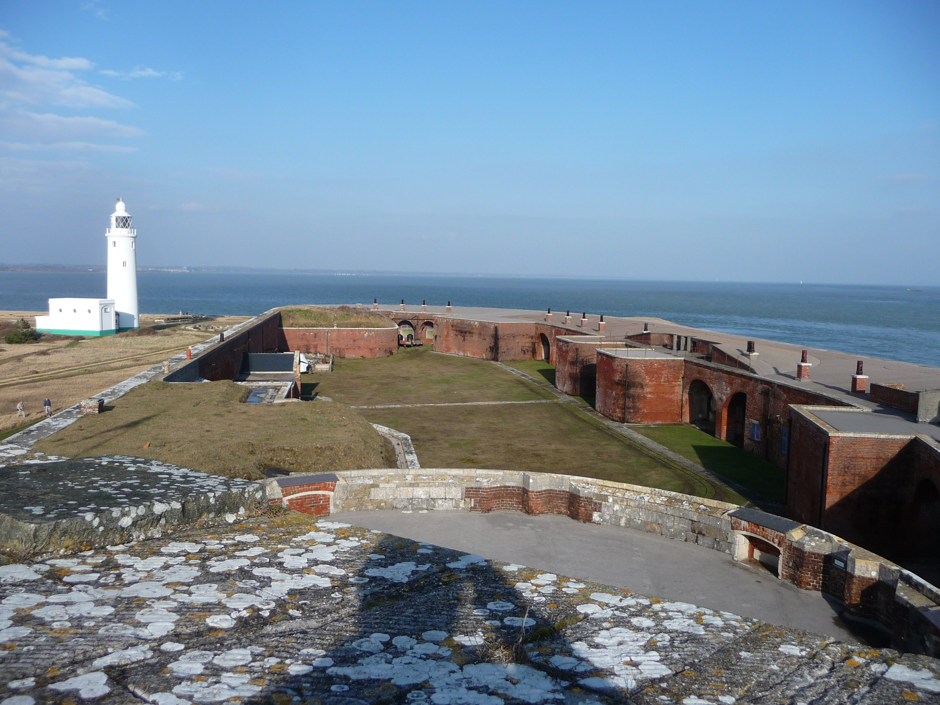 Hurst Castle : East Wing &amp; Lighthouse Looking out across the eastern section of the castle and also the coastline can be seen in the distance across the Solent.