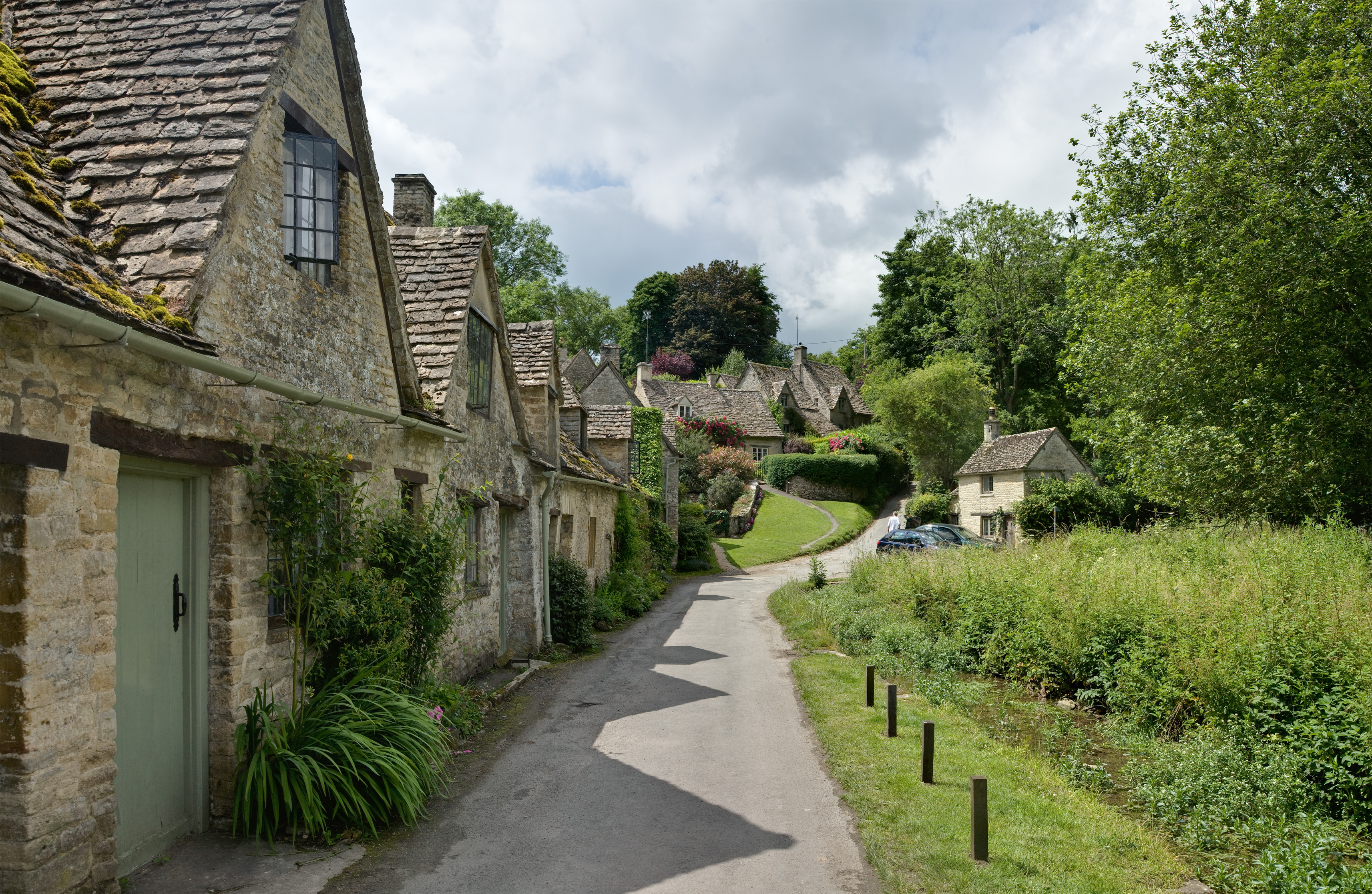 A row of cottages in Bibury, Cotswolds, England.