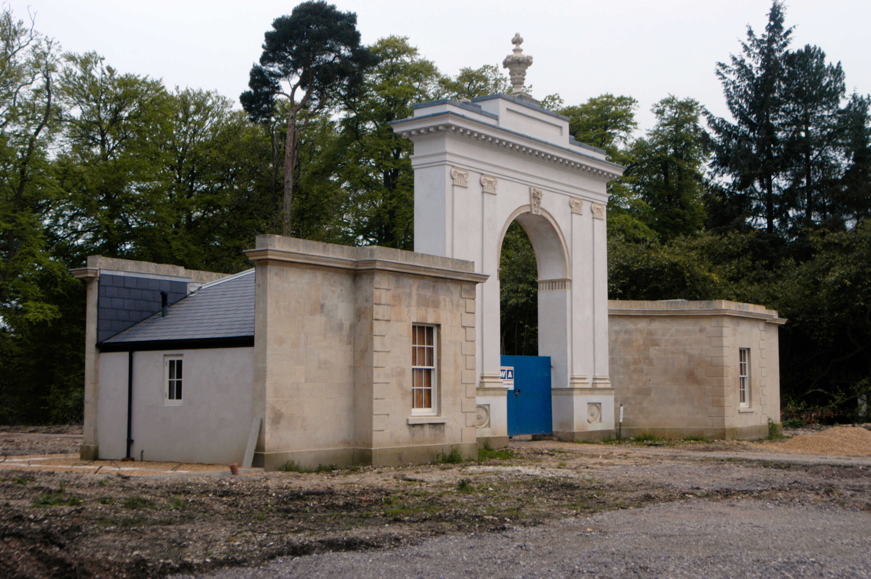 My photo (taken my me, R. de SalisRodolph (talk) 11:54, 11 May 2014 (UTC)) of London Lodge (1793), brick but Coade stone dressed, and wings (1840), Highclere Castle, Hampshire, May 2014.