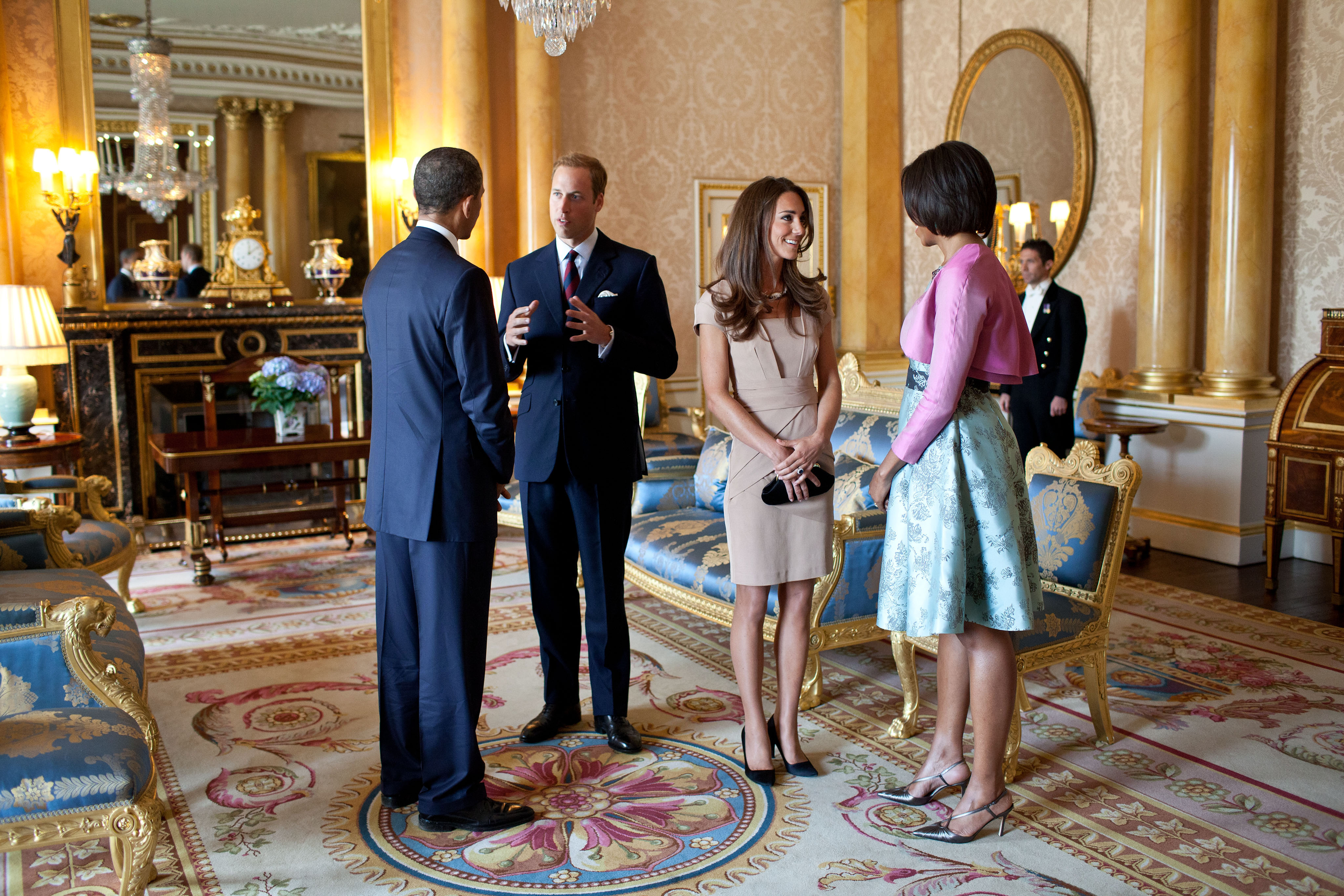 President Barack Obama and First Lady Michelle Obama talk with the Duke and Duchess of Cambridge in the 1844 Room at Buckingham Palace in London, England, May 24, 2011. (The mint hued floral frock of Michelle Obama is the work of Barbara Tfank, from the designer's Resort 2011 collection)