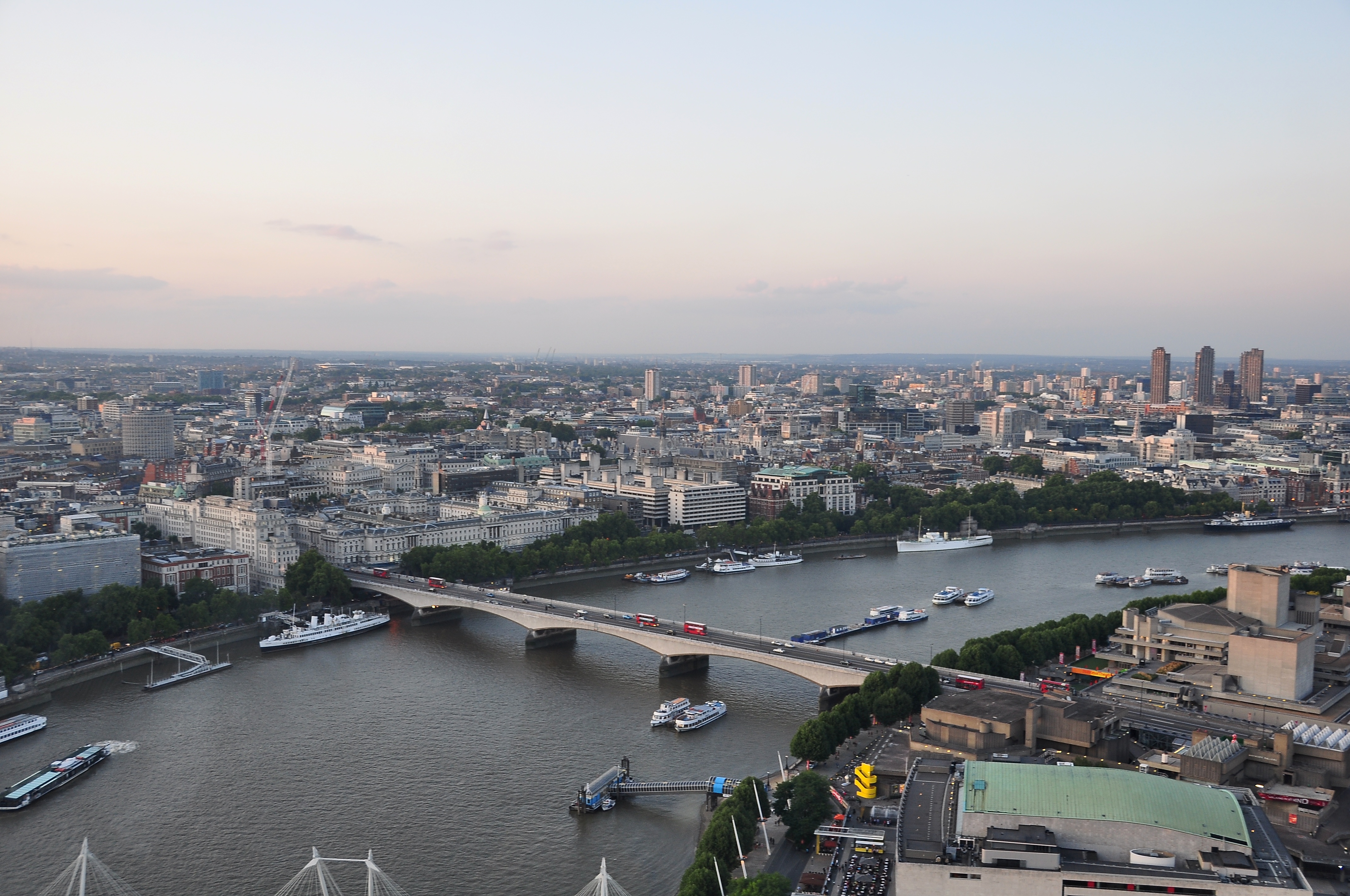 River Thames in London: with Waterloo Bridge and Victoria Embankment in the centre.
Several permanently moored ships are visible: TS Queen Mary, St Katharine, HMS Wellington, HMS President.
The piers below Waterloo Bridge are Savoy Pier (left) and Festival Pier (right).