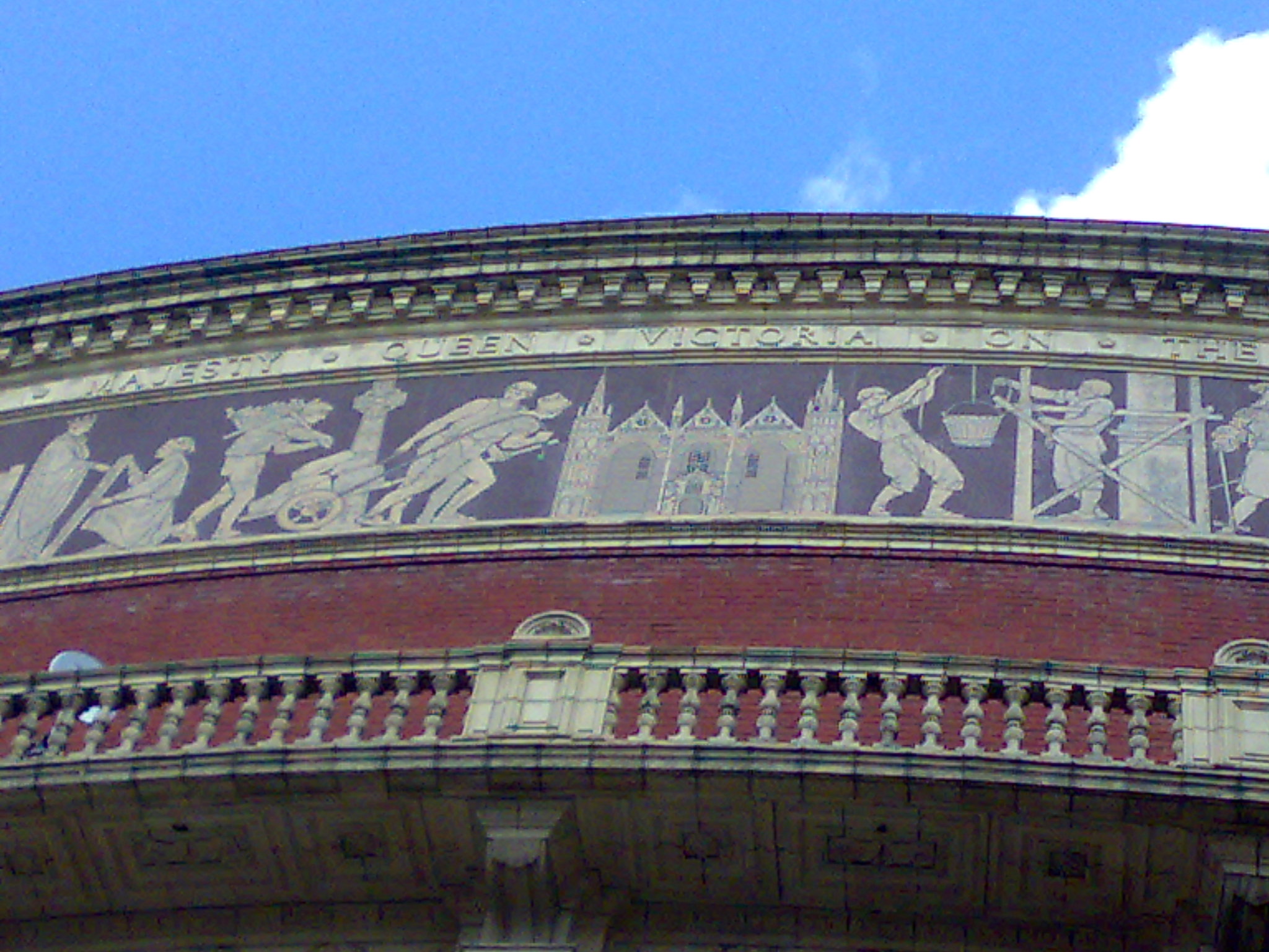 A portion of the terracotta frieze running around the Royal Albert Hall, showing the representation of the West Front of Peterborough Cathedral