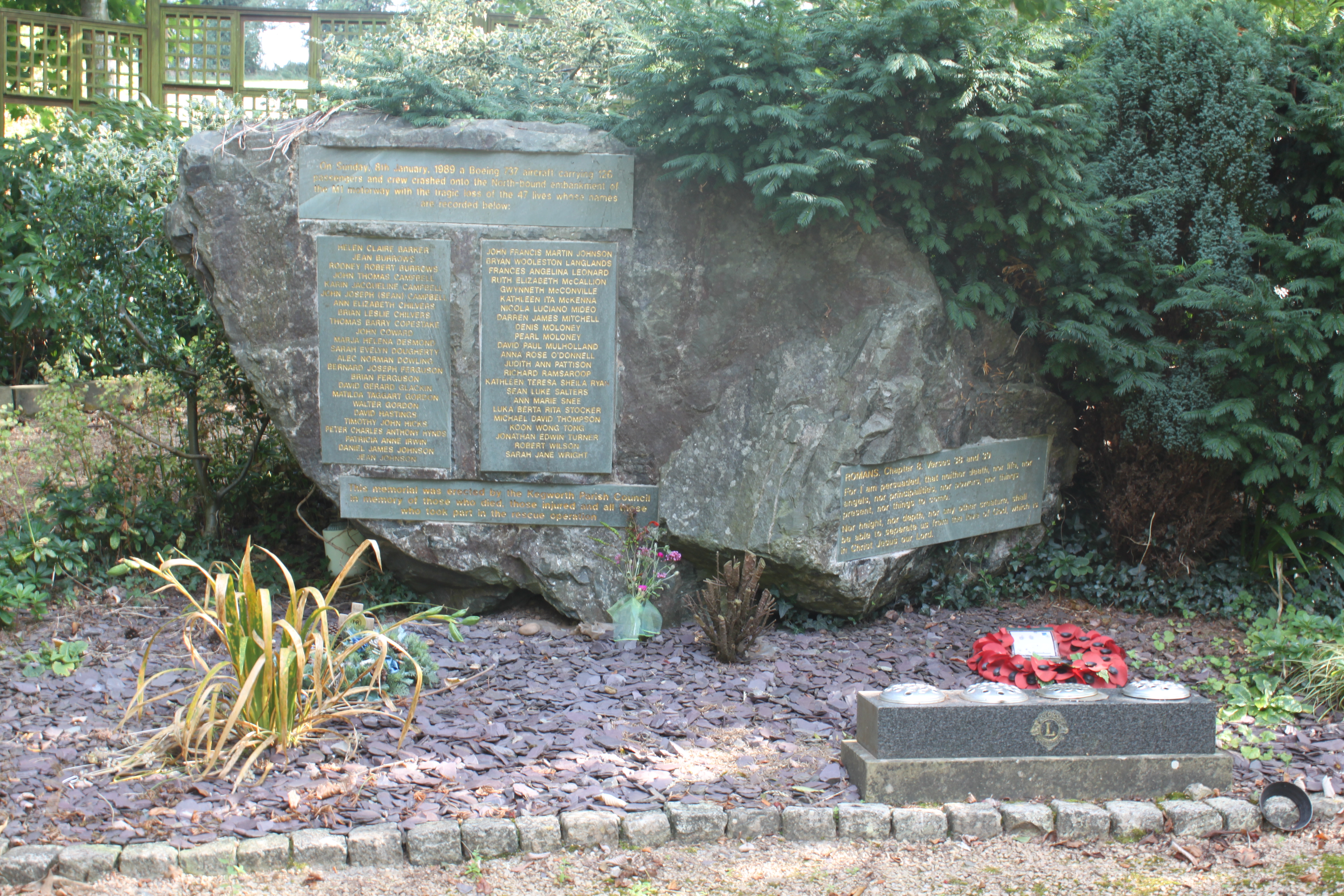 The memorial is situated at the top of Kegworth cemetery on Whatton Road in the village.  It consists of several engraved stones listing all 47 names; as well as information about the disaster, a dedication from the people of Kegworth and a Bible verse taken from Romans chapter 8, verses 38 and 39.
There is also seating around the back of the main stone for private contemplation, out of sight of the main cemetery.

There are other memorials in the village including a plaque on the Ashby Road bridge above the M1 motorway, close to where the plane came down; and a memorial bench, also near the scene, to commemorate the 30th anniversary. The Kegworth cemetery forms the main memorial.