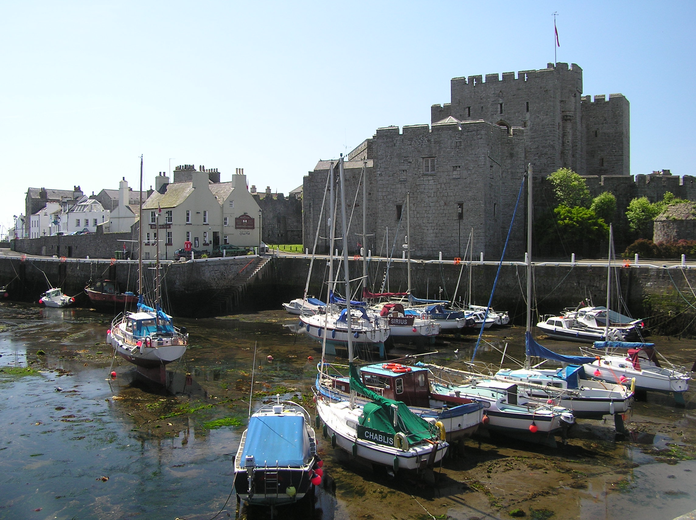 Castle Rushen, seen from across Castletown Harbour at low tide. Also in view to the left is the Gluepot Pub. Picture by Paul Dyer, June 2005.