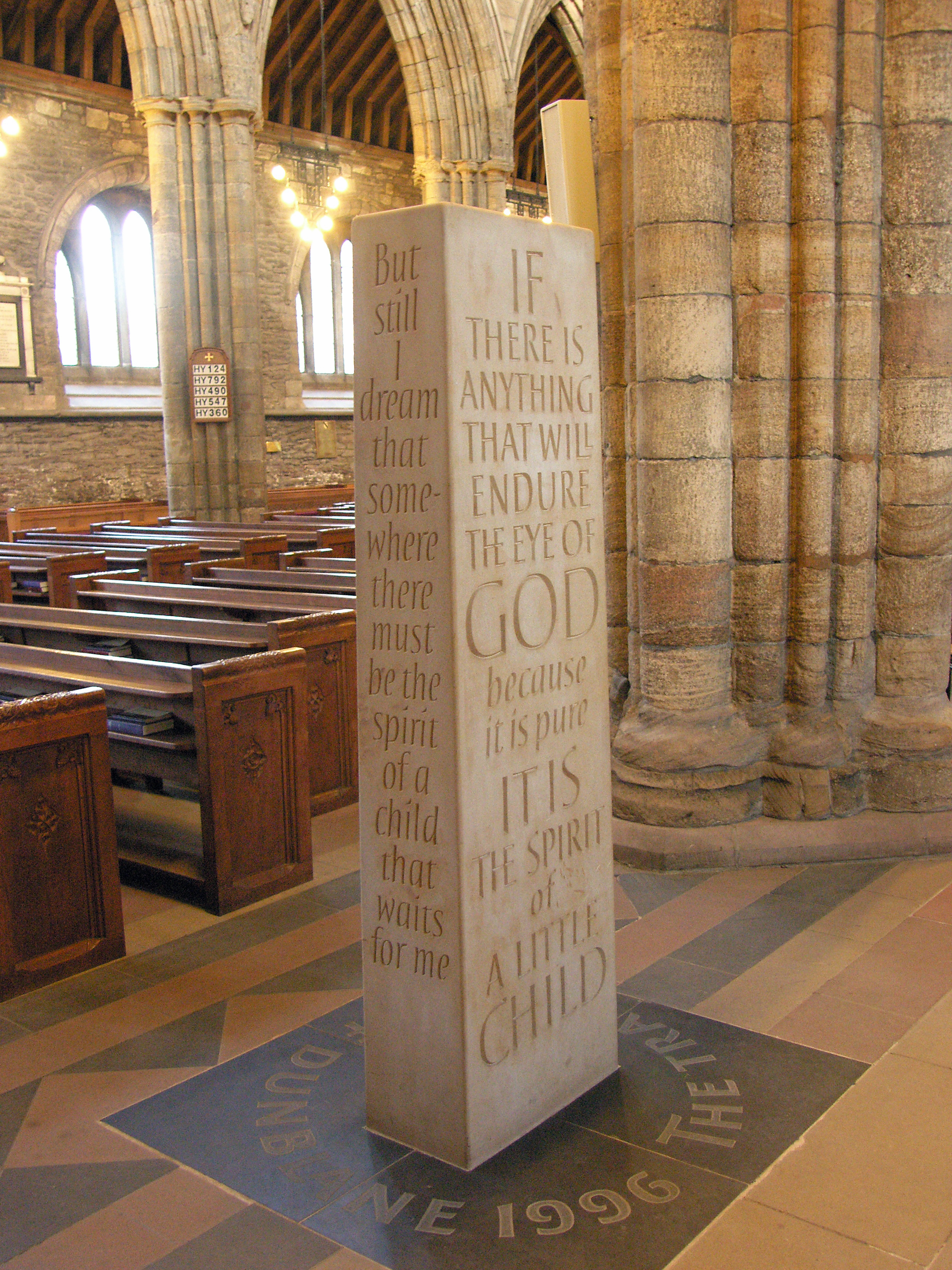 The Standing Stone sculpted by Richard Kindersley to commemorate the events in Dunblane of 13th March 1996 - the Dunblane school massacre. Text on left is from The poet's journal by Bayard Taylor (page 80, published by Ticknor and Fields in 1863); text on right is from The Children's Prayer by Richard Henry Stoddard (born 1825, died 1903).