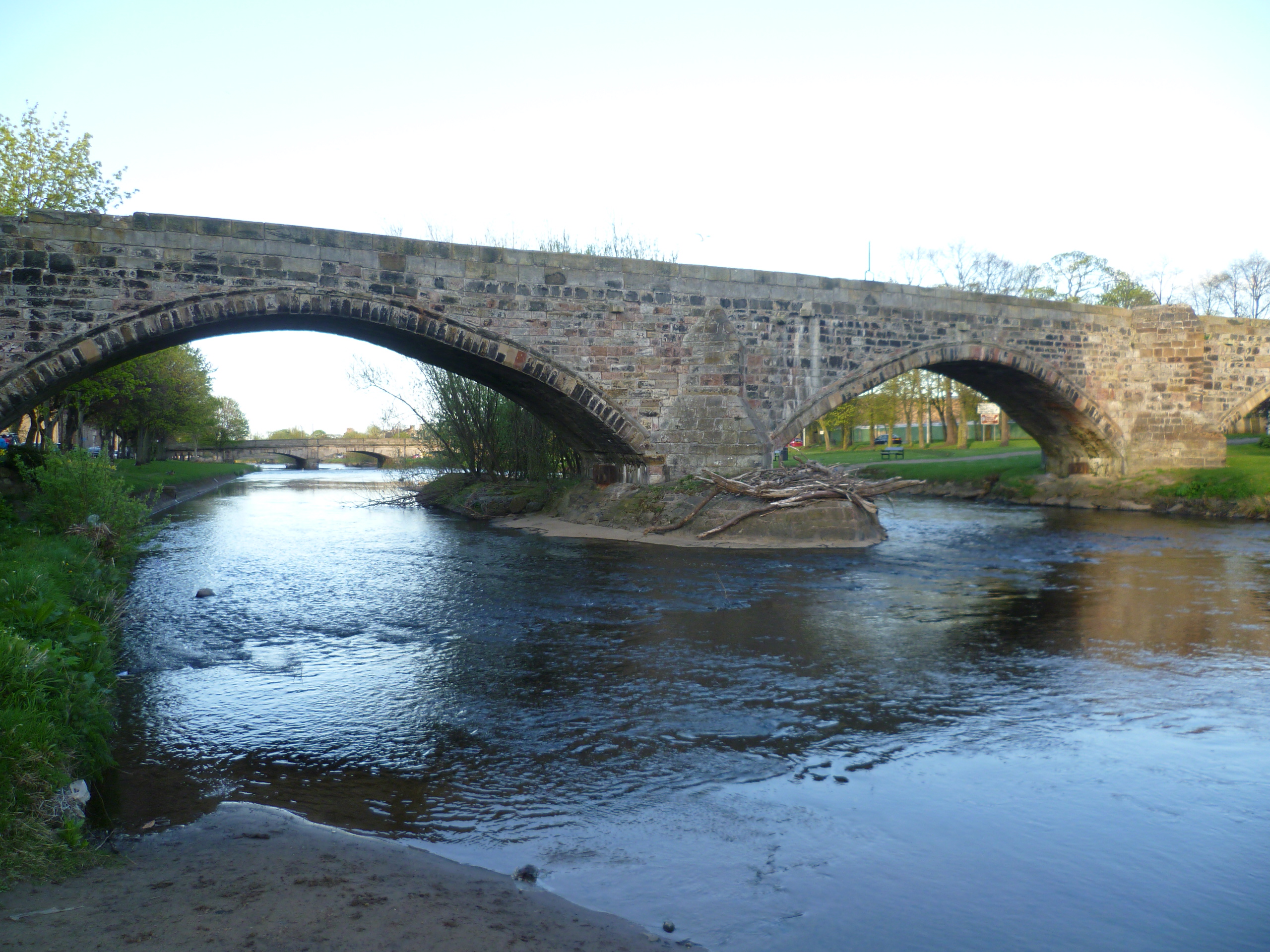 The Auld Brig dates from the 16th century, but is known locally as the 'Roman Bridge', because the Romans are known to have bridged the Esk at this spot. Many an English and Scottish army has crossed the bridge in its time. After the Battle of Pinkie in 1547, the routed Scottish army came under fire on the bridge from English ships at the mouth of the Esk and in 1745 Bonnie Prince Charlie's Jacobites crossed it on their way to and from the Battle of Prestonpans. This is the view looking northwards towards the river mouth.