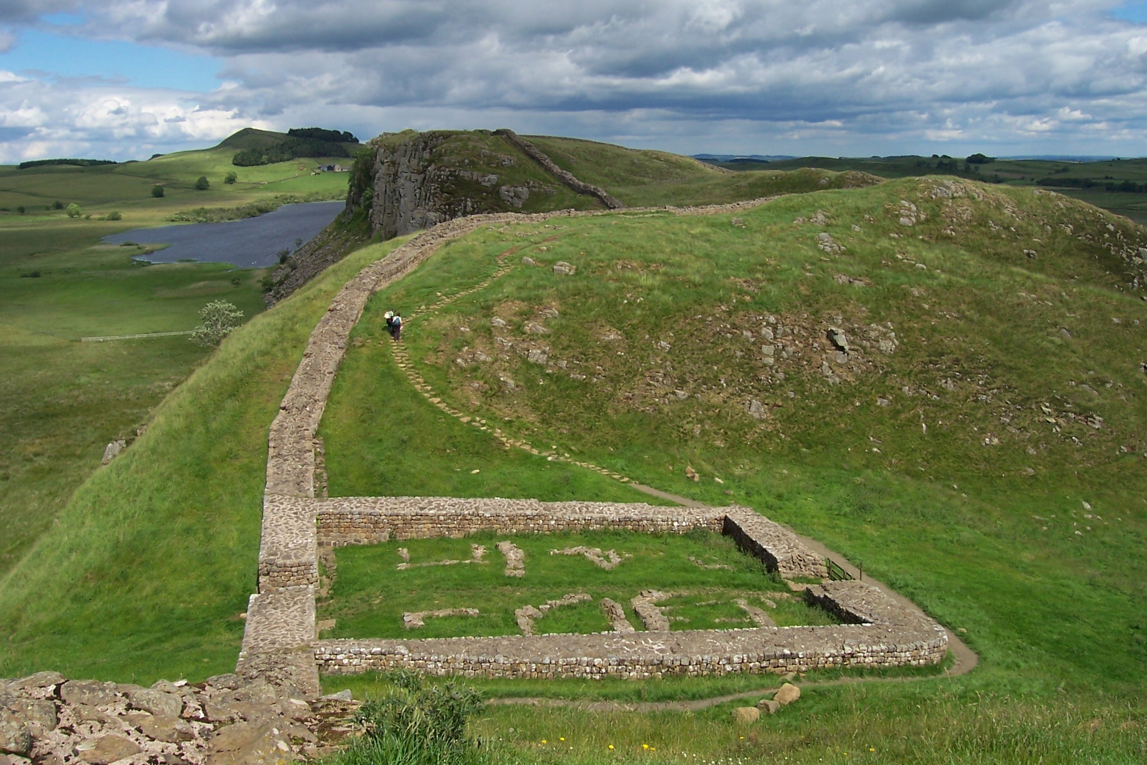 The remains of Milecastle 39 (coordinates 55° 0' 13.12" N, 2° 22' 32.74" W) on Hadrian's Wall; near Steel Rigg, looking east from a ridge along the Hadrian's Wall Path. Milecastle 39 is also known as Castle Nick.