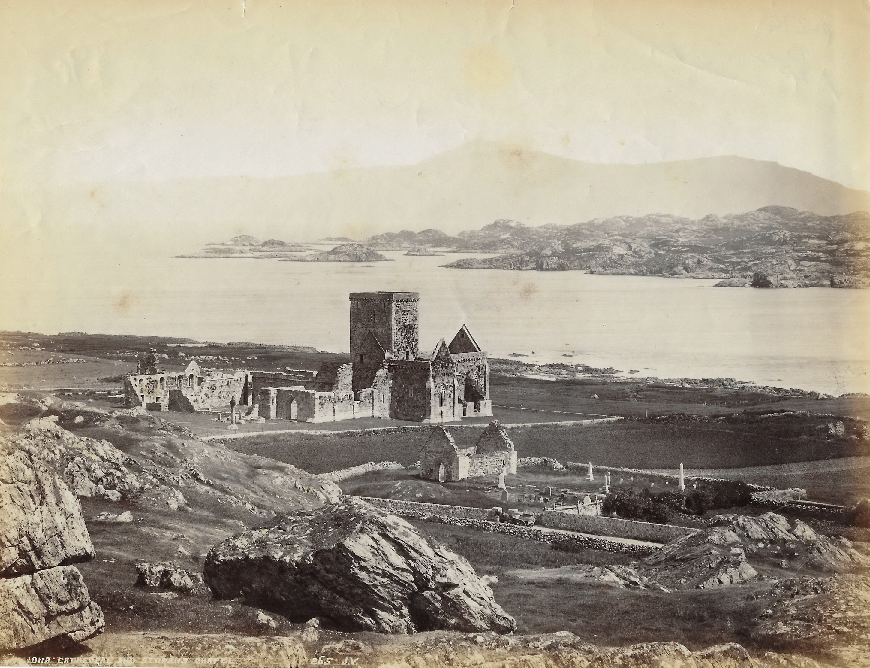This view of Iona Abbey shows the Abbey in its ruinous condition before work to restore the Abbey commenced in the early C20