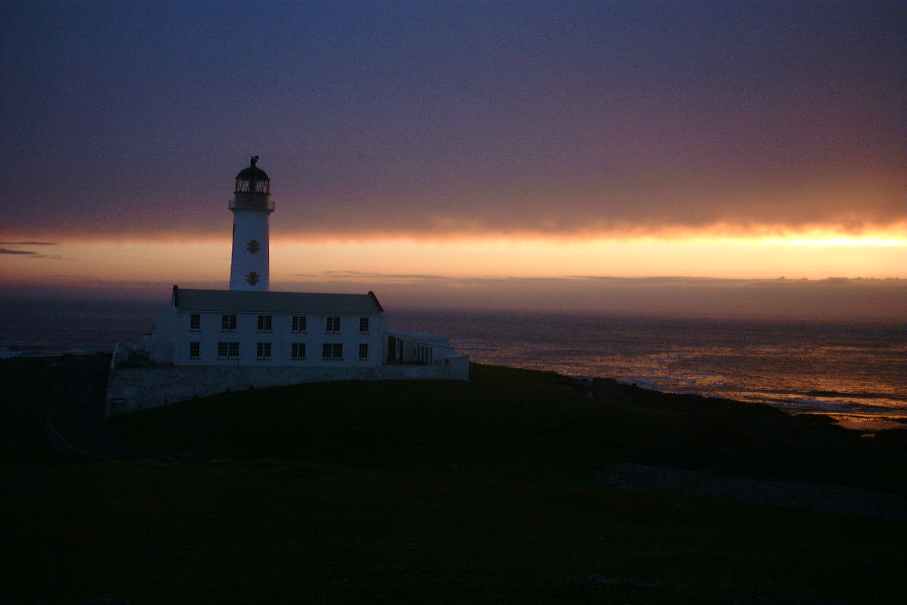 Sunset over the South Lighthouse at Fair Isle, Shetland.

Photo taken in august 2001 by LHOON