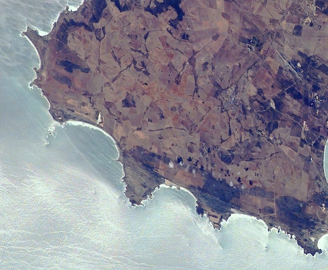 View of the West Coast region of the Western Cape, South Africa, taken during ISS Expedition 6. It shows Cape Columbine and its vicinity in the Western Cape, South Africa. Vredenburg is just right of center.