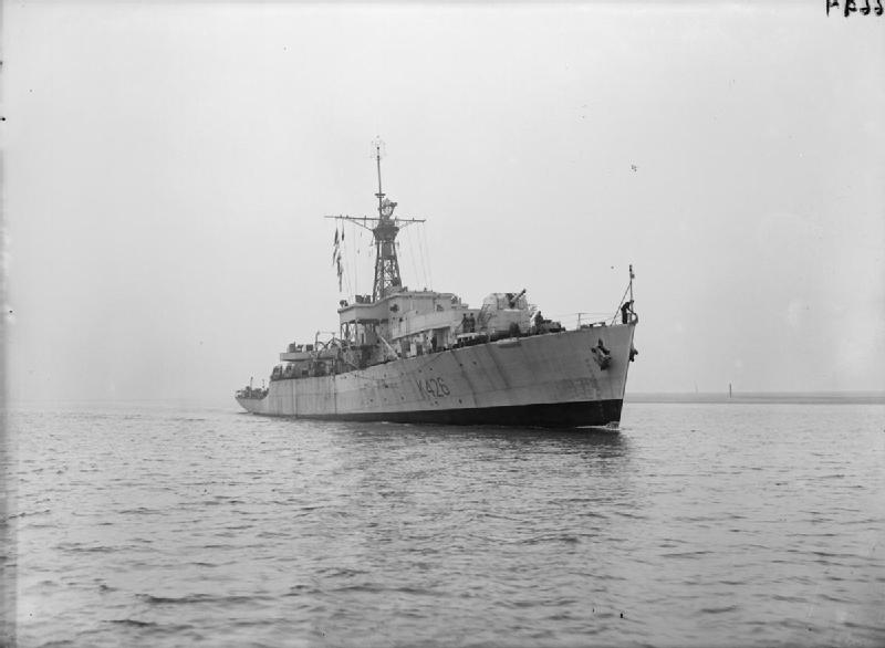 Royal Navy frigate HMS Loch Achray underway, coastal waters.