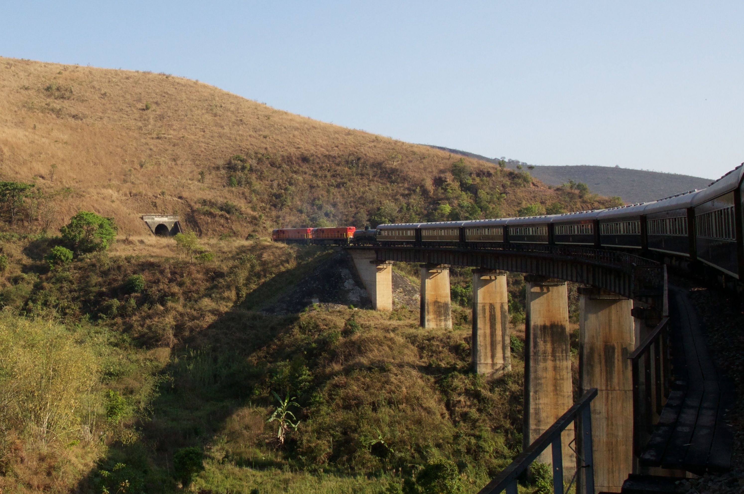 Rovos Rail Pride of Africa on the bridge across the Mpanga River in Tanzania. This viaduct is 160 feet high and the tunnel that it heads into is one-half mile long.