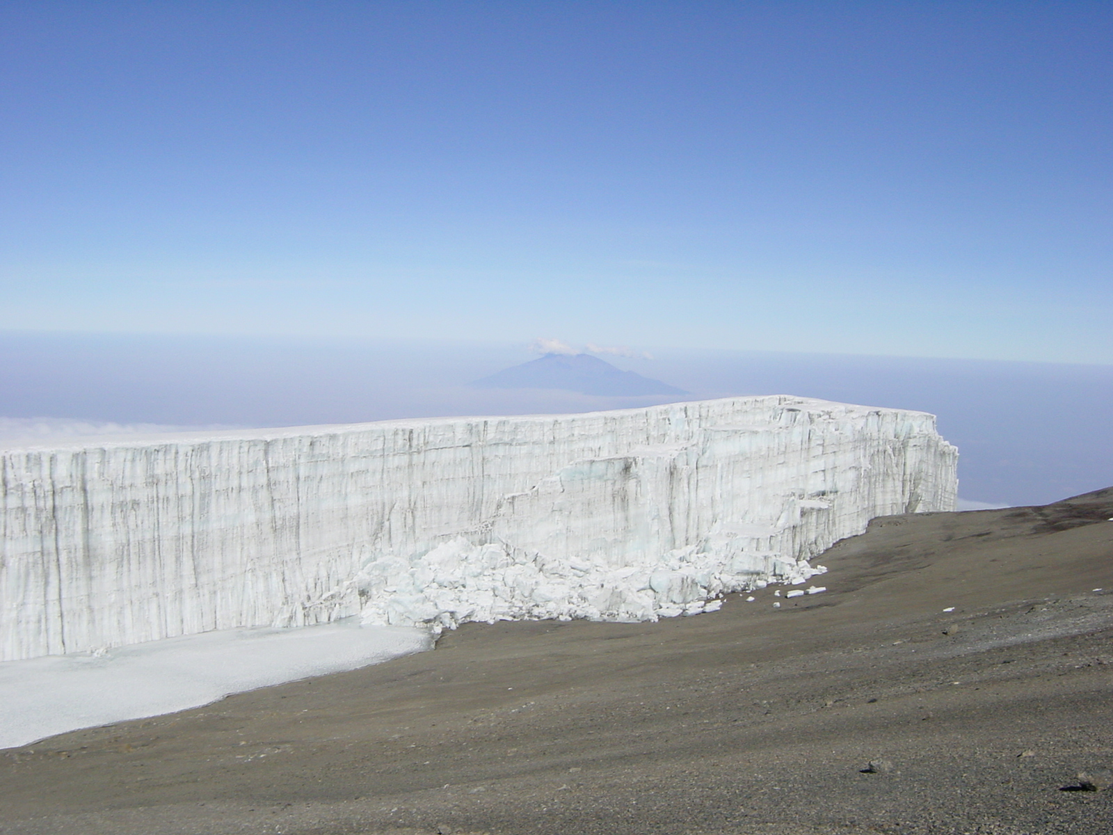 Rebmann Glacier on top of Kilimanjaro, Southern Icefield. Mount Meru in background.